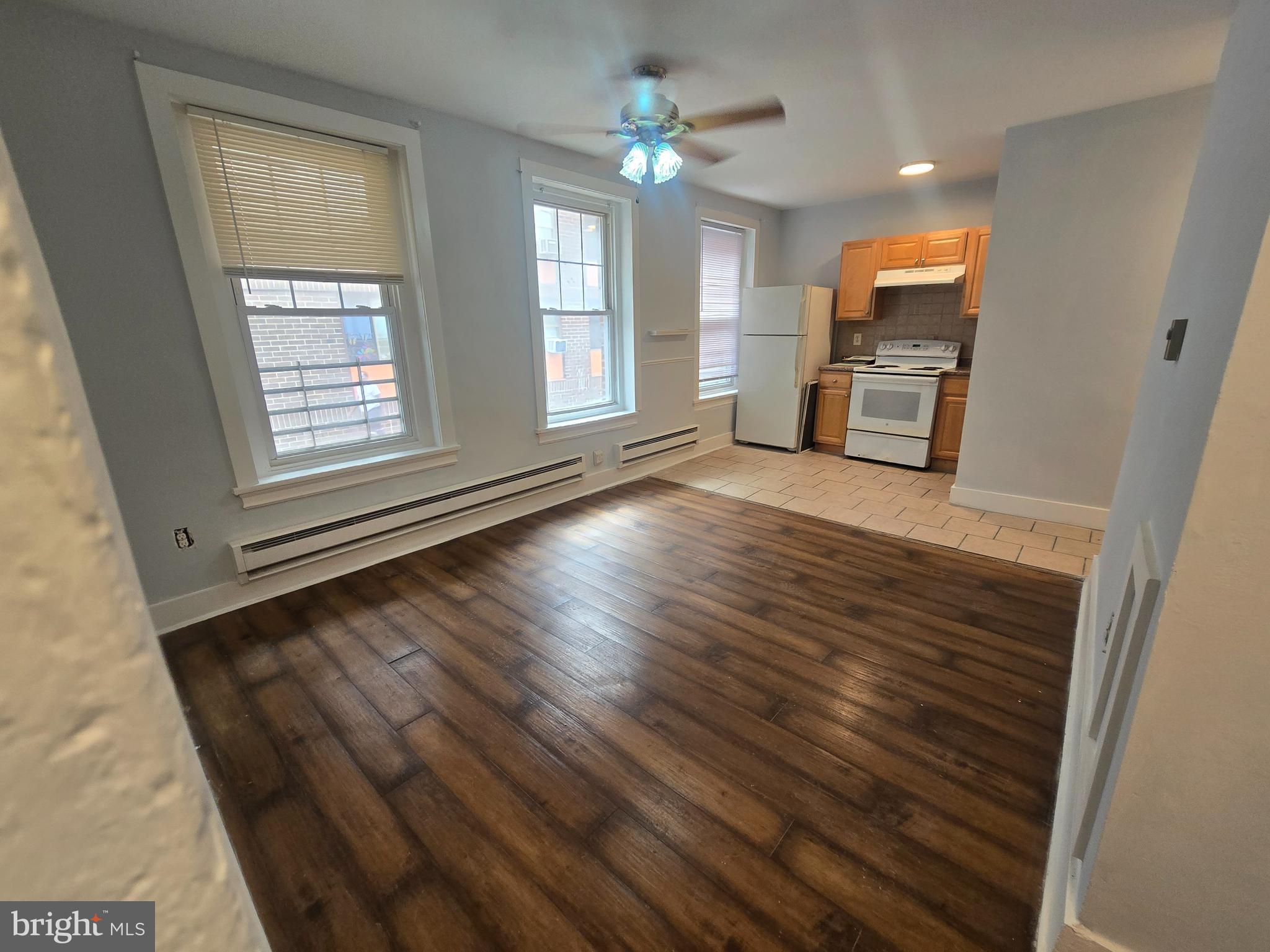 This well maintained apartment is ready for immediate move-in. This first floor unit features a nice sized living room and two medium sized bedrooms. All the rooms have new hardwood flooring and undated ceiling fans. Shared laundry is available on lower level. Additional, secured storage is also available on lower level for small fee.