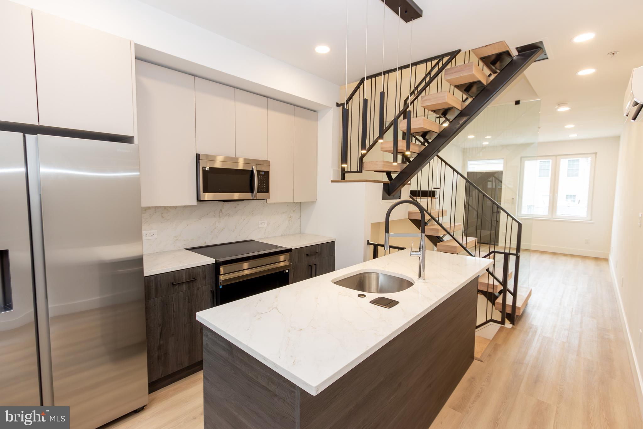 ***10 Year tax abatement! Welcome to a contemporary new construction home in a rapidly growing neighborhood just steps away from Northern Liberties and Fishtown. This home offers the perfect blend of luxury, functionality, and modern design, featuring 3 bedrooms, 3 full bathrooms, and a finished basement that can be customized for a home theater, gym, or additional 4th bedroom. The home equipped with European tilt-and-turn windows for superior soundproofing. These advanced windows provide excellent insulation, ensuring a comfortable climate year-round. For ultimate comfort, the home features a 5-zone LG mini-split system, providing individually controlled heating and cooling for each room. The first floor includes a living room flooded with natural light and high ceilings. A custom staircase with 4-inch thick solid oak steps and floor-to-ceiling glass adds architectural sophistication, enhancing the airy feel. This open layout seamlessly flows into the kitchen with custom cabinetry, quartz countertops and backsplash, SAMSUNG appliance package with an induction range, and a GROHE faucet, adding style and functionality. On the second floor, you'll find 2 bedrooms and a full bathroom with a tub. The master suite on the third floor features a spacious bedroom, a roomy walk-in closet, and a bathroom with a shower featuring custom large-format tiling, a double sink vanity, and stylish black and gold accents. White oak-colored LVT flooring flows throughout the home, adding warmth and elegance while offering a durable and stylish alternative to traditional hardwood. The crown jewel of this home is the split roof deck, offering expansive city views—from the Ben Franklin Bridge to Center City—making it the ideal space for entertaining or enjoying a sunset. Located on a tucked-away block, Darien Street offers privacy with minimal traffic, all while being surrounded by development, making it a prime investment opportunity. House is a short distance from top restaurants on Front Street, including Laser Wolf, Front Street Café, Mulherin’s, and Luna Café.
(Only 3% down required, Conventional Mortgage insurance WAIVED.
Rate 1% below our current rate. Today it’s 6.0%. Primary buyer
does not need to be a first timer, $6,000 lender credit for a first timer. No income restrictions)