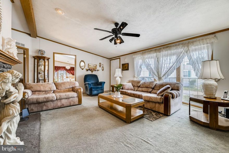 Your new address is on Everlasting Lane.. It's a perfect first home or you're purrfect forever home.  A 2000 Skyline manufactured double-wide mobile home. Dimensions are 56 long by 26 wide approximately 1,456 square feet. Three bedrooms and 2.5 bathrooms. The perfect amount of space with 4 skylights and two-bay windows for lots of natural light. Everything you need for one level living in your home. Spacious, open and eat in kitchen with lots of counter space and cabinets. All of the appliances convey.  Laundry room has the washer and dryer. Master bedroom is also very spacious with a private bathroom with  soaking tub and separate shower. ..Dual vanities and lots of space.. Open and spacious living room with a  fireplace make for a comfortable and cozy atmosphere that you won't want to leave during the winter months.. It will be your happy place! Central air conditioning and neutral decor --- there is a deck for outdoor enjoyment and a ramp to the side yard for entry/exit access,, as well as a shed on the property.. PARKING PAD!!    Peppermint woods is a beautiful community in Middle River Right off of Eastern boulevard.. please visit the website or call the management office for Peppermint Woods and William Estates for all of the amenities in this charming community as well as the application and any entry fees.   All purchases are subject to park approval . . Monthly ground rent is also subject to the park management at time of application and purchase. --   Local dining, shopping and other amenities are within miles from your front door. Enjoy the convenience of being close to just about everything including the historic Benji's Drive-In just minutes outside your door! Enjoy Baltimore County living! Rent per month is currently $810 and includes water/sewer/snow removal and trash pick up  (please verify with park management) https://www.mhvillage.com/parks/14842