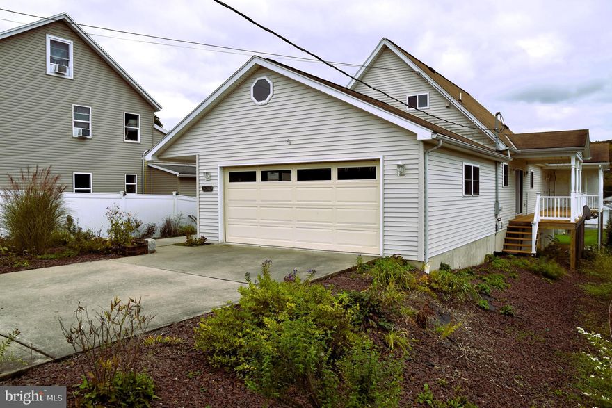 A well-maintained Custom-built Home in 2006 is located in Tamaqua Borough in Eastern Schuylkill County, just off Pennsylvania Route 309, which connects it with Allentown and Philadelphia to its South and Hazleton and Wilkes-Barre to its North. It is Zoned R-4, Residential / Commercial, and Medium to High-Density Suburban, creating several conversion opportunities. The unique Open Floor Plan featuring two Full Kitchens with individual outside entrances can be used as a private In-law Suite with little to no renovations. 

There is an attached Two Car Oversized Garage and two additional One-car garages with separate access in the rear. The Basement has 1000+ Sq. Foot Insulated Additional Space with an at-grade level Entrance, Water and Propane Access, Drain Access, and Electricity. Possible Uses could be additional Living Quarters, added Living Space, Gym, or Office space with convenient Garage Parking in the rear. There is Abundant Natural Light throughout the home from the Skylights, Sliding Glass doorways, and many Thermal Insulated- Windows with Custom Vertical Blind Treatments adjusting the preferred amount of light. 

The two Full Bathrooms both contain Low-maintenance, Shower/Tub, Shower/Stall Fixtures, and Linen Closets. The Three Large Bedrooms have Walk-in Closets with Light and additional Storage in the upper Bedrooms in Attic Eves and Hallway Closets. The Composite, Solar Lit Deck along the right side provides Outdoor Dining Areas and Sunset Views of the Appalachians.