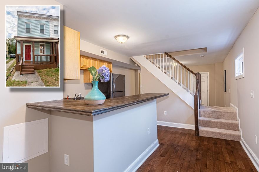 SIMPLY CHARMING PORCH FRONT ROWHOME WITH LARGE FENCED YARD!  Features include gleaming hardwood floors throughout the main level, and inviting living room, updated kitchen with ample cabinet space and space for a table, main level bedroom with a hall full bath.  The upper level offers 2 additional bedrooms with a shared full bath.  Located close to Union Memorial Hospital and Johns Hopkins University!