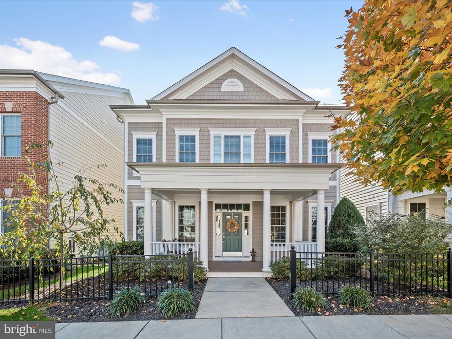 Welcome home to 11421 Ellington Street in Howard County’s favorite neighborhood - Maple Lawn! Nestled on one of the community's quietest and most beautiful streets off the main road in the Midtown-West District, this Bristol floor plan by luxury home builder Michael Harris Homes is not to be missed. This 4 bedroom, 4.5 bathroom beauty boats nearly 5,000 square feet of luxury living space, every inch of which has been exceptionally well-maintained. 

The large covered front porch welcomes you inside the main level, where 10’ ceilings immediately impress. Gleaming hardwood floors are found throughout the main level and 3-piece crown moulding graces the formal living and dining areas. The living room features a gas fireplace and an entire wall of floor-to-ceiling windows which allow for an abundance of natural light. The gourmet kitchen features 42” shaker-style espresso cabinetry, granite countertops and a large center island. The eat-in area just off the kitchen allows access to the custom multi-level flagstone patio and the mudroom. A spacious main-level office featuring French doors, a half bath and a butler pantry complete the main level. 

The upper level presents double doors leading into the primary suite complete with recessed lighting and dual walk-in closets. The primary bathroom features a dual sink vanity, large shower stall and garden tub. A guest suite with en suite bathroom, two additional bedrooms with a shared bathroom, and a spacious laundry closest are also found upstairs. The lower level offers a sprawling recreation room, another full bathroom and two large unfinished storage areas. Zoned for highly rated Howard County Schools, conveniently located close to all major Baltimore/DC commuter routes, and with enviable amenities including a resort-style community pool, tennis courts, pickleball courts, basketball courts, state-of-the-art gym and more, you’ll quickly see why Maple Lawn is one of the most sought-after communities in the region. Hurry! 11421 Ellington Street won’t last long.