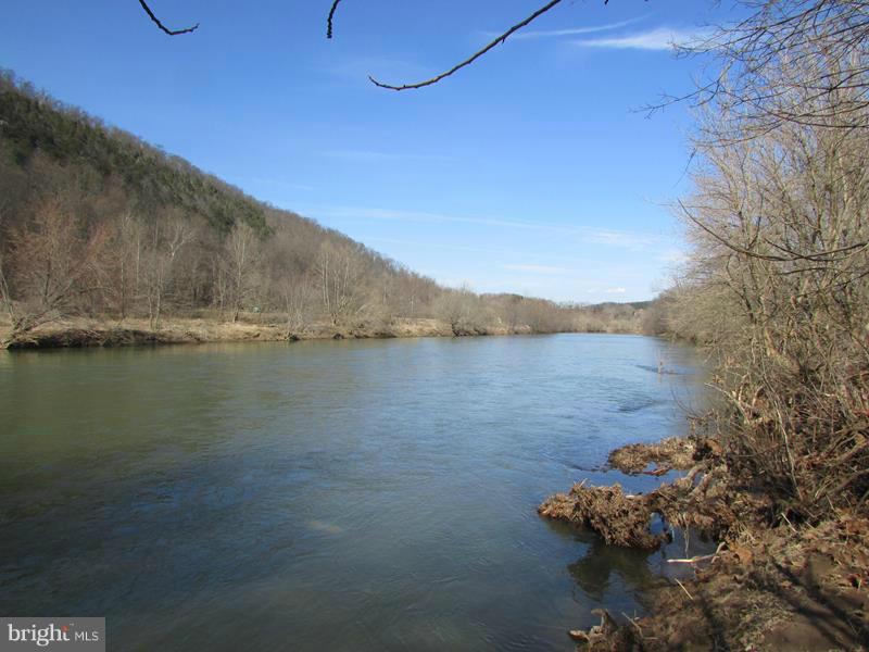 ROLL ON BIG RIVER! 20 ACRES WITH 1097 FEET OF FRONTAGE ON THE SOUTH BRANCH OF THE POTOMAC RIVER. 10 AC OF HIGH AND DRY FLAT WOODLAND WITH DRIVEWAY INSTALLED TO BUILD SITE OVERLOOKING RIVER, DRIVEWAY ALSO LEADS TO 10 ACRES OF RIVERBOTTOM MIX OF FIELDS & FOREST. SUPER COOL LAGOON/POND IN BOTTOM LOADED WITH FISH. HUNT,SHOOT,CAMP,BUILD,BOAT,FISH,ATV'S OR JUST RELAX. RARE OFFERING. 2 HOURS FROM DC/BALT