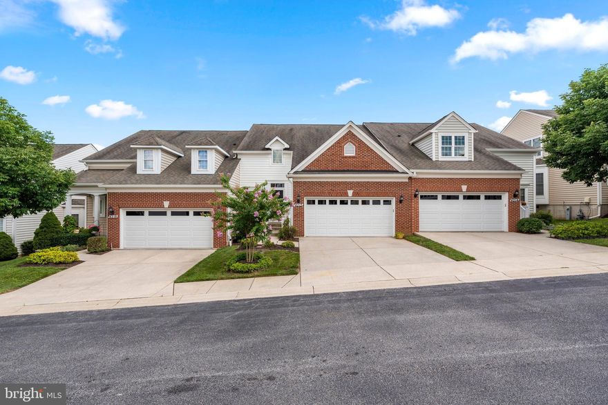 Must see, 2 car garage, 3 finished level villa in sought after Village Crest, Taylor Village. Perfect move-in condition features: tall 9' ceilings; gleaming hardwoods throughout the main level; granite surfaces throughout kitchen and all bathrooms; gourmet eat-in kitchen w/42" maple wood cabinets, upgraded stainless steel appliances, gas cooking and corner pantry; family room off kitchen w/warm gas fireplace and atrium door to composite deck; separate dining room w/extensive moldings; main level owner's bedroom w/huge walk-in closet and en suite full bathroom w/walk-in shower and double sinks; 2-story foyer, powder room and laundry room round out the 1st floor; upper level w/2 bedrooms, 1 full bathroom and a spacious loft that is an ideal home office; fully finished lower level a huge rec room w/vinyl plank floor, 4th bedroom, 3rd full bathroom and a large storage/utility room; extensive upgrades include shutter blinds, in ceiling built-in speakers, crown molding, chair rail and wainscoting. Community fees include: lawn mowing, mulching, snow removal, roof replacement, community management, indoor and outdoor pool (indoor is for 55+ residents only), 2 gyms (1 is for 55+ residents only), meeting room, card/game room, 2 tennis courts and tot lot. This is a tremendous home with a lot of living space w/endless community amenities.