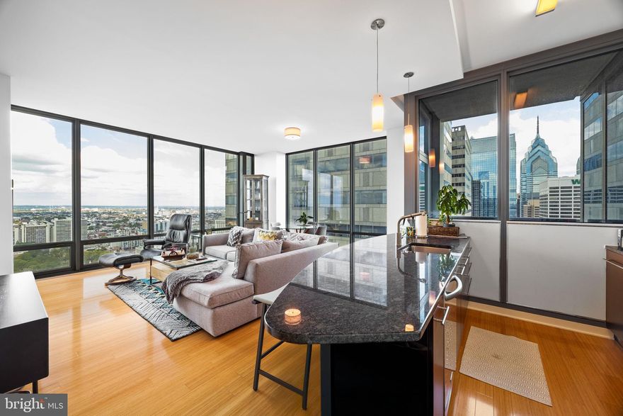 Welcome to Murano Residence 4306 – a breathtaking high-floor two-bedroom, two-bath condominium offering sweeping north-facing skyline views of Philadelphia. This 43rd-floor home features soaring 11-foot ceilings, creating an expansive sense of space and light throughout.
The open-concept layout is anchored by a sleek kitchen with granite countertops, high-end stainless steel appliances, and a breakfast bar that flows seamlessly into the living and dining areas, perfect for both entertaining and everyday living. Floor-to-ceiling windows frame dramatic city vistas, while hardwood floors provide warmth and sophistication.
The spacious primary suite boasts a large walk-in closet and a luxurious en-suite bath with double vanity, soaking tub, and separate glass-enclosed shower. A well-proportioned second bedroom and full bath complete the home, offering versatility for guests, office, or personal retreat.
Additional conveniences include an assigned parking space in the secure garage and a deeded storage locker, providing ample flexibility for urban living.
As a resident of the Murano, you’ll enjoy world-class amenities including a 60-foot indoor heated pool, fully equipped fitness center, sundeck, community room, and 24-hour concierge services. Located just steps from Rittenhouse Square, the Schuylkill River Trail, Trader Joe’s, and Center City’s finest dining and cultural destinations, this residence combines luxury and convenience at its finest.
Don’t miss this rare opportunity to own a premier unit with soaring ceilings and iconic views in one of Philadelphia’s most sought-after addresses.