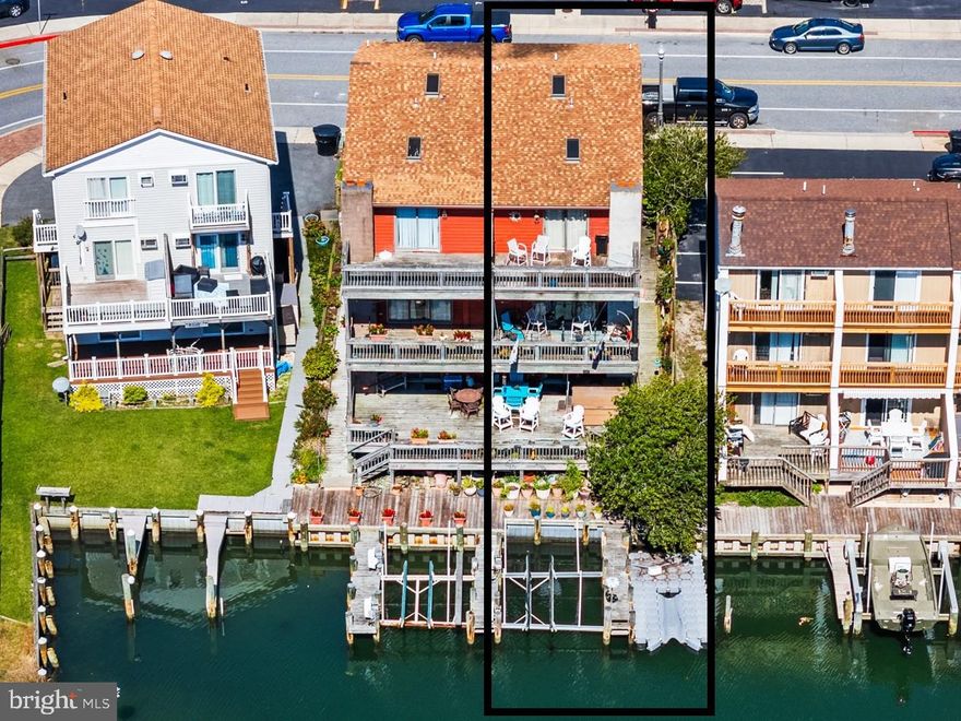 🌊 Waterfront Living • 🚤 Private Docks • ✨ 4 Private Decks •🏡 No HOA or Condo Fees!

Welcome to 617 Bayshore Court, Unit B — a spacious 3-story semi detached home with cedar siding, offering 3 bedrooms, 3 full baths, 4 spacious decks, hot tub for your enjoyment and an attached garage in the sought-after Bayshore Estates community. Fee simple ownership means no HOA and no condo fees 🙌 — true freedom in Ocean City living!

✨ Key Features

2,356 sq. ft. of living space 🏠 (built 1985)

Two fully owned docks 🛥️⚓ — includes a floating jet ski dock + boat lift

Four oversized decks 🌅 — 3 face south over the canal, 1 to the north with a peek of Isle of Wight Bay

Attached garage 🚗 + slab-on-grade foundation for stability with extensive storage shelves

2550 sq. ft. lot — fee simple, no ground rent

🏠 Interior Layout

1st Floor: Multipurpose flex room used as a family room with pellet stove and utility room with refrigerator, water heater and a man's half bath + 2 car garage access 🔑

2nd Floor: Living level with recessed living room, dining area with counter seating and kitchen 🍳 opening to a waterfront deck 🌊. Kitchen has appliances installed in 2021 including stove top, in wall oven and microwave and new refrigerator with water, ice and coffee. Living room is accented with redwood ceiling and wood burning fireplace.

3rd Floor: Primary suite with private deck, walk in closet, attic assess and bathroom 🌞 + additional large bedroom with 3 closets, view of open bay & full bath 🛌🛁

📍 Lifestyle & Location

Step outside to your fully owned docks 🚤🎣 and launch into the Isle of Wight Bay for boating, fishing, and watersports. Hungry? Walk or cruise to favorites like Dry Dock 28, Coins Pub and Restaurant, Buxy's Salty Dog, Pit & Pub and Fish Tales, Happy Jack’s, and Mother’s Cantina 🍽️. Fun is everywhere with Jolly Roger Amusement Park, Speedworld & Splash Mountain 🎢💦 just minutes away.

💡 Opportunity

This home is aggressively priced 💲 to reflect its current condition — making it one of the best values for direct waterfront living in Ocean City. With no HOA, no condo fees, and fully owned docks, it’s the perfect canvas to update 🔨, refresh 🔨, and transform into your dream coastal getaway 🌴☀️. A beautiful pallet for improvement this semi detached home rewards your vision and effort — offering the chance to build instant value while creating the home you’ve always wanted. Start now and be ready to enjoy the Summer of 2026 in style! 🏖️🌞