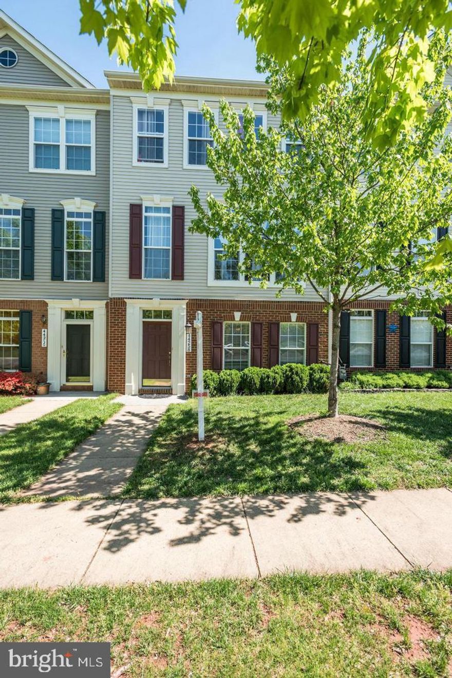 Extremely well maintained 2-car garage townhome with 4 bedrooms and 3.5 bathrooms.  Hardwood floors throughout the main level, large kitchen with stainless appliances, granite countertops, upgraded cabinets leading to the deck.  Formal living and dining room.  Three spacious bathrooms with two full bathrooms and the laundry room.  The town home is a premium lot with lots of available parking in the front and front courtyard to play.  Shows like a new/model home.