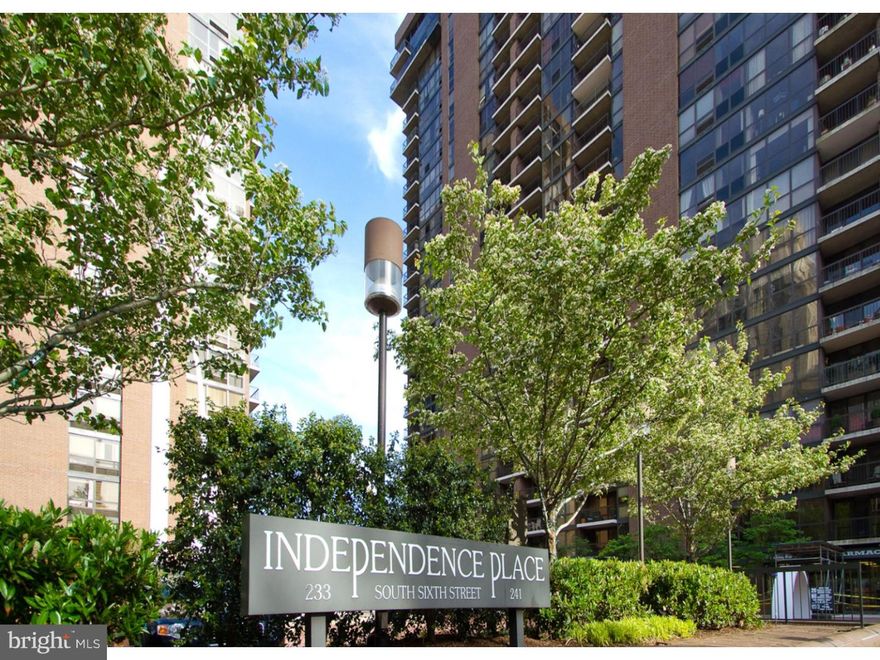 Washington Square Penthouses in Independence Place on the top (25th) floor rarely change owners. This professionally designed condo offers custom, built in cabinetry, high ceilings, a wood burning fireplace, 1980's balcony, hand-carved mahogany doors, floor to ceiling marble in the baths and a retractable wall for the bedroom. This condo has windows facing east. View the Delaware River, both Bridges, center city skyline, the USS New Jersey and all of Society Hill. Formerly a two bedroom, now set up as a one-bedroom unit, there is an alcove which can be made into another sleeping area. Two full bathrooms, the master featuring a deep whirlpool tub. Closets and cabinetry are maxed providing storage and double use of some spaces. 24/7 concierge and an underground parking lot with monthly fees, so you can have many parking spaces. Independence Place offers a bike storage room and community room if you need a larger space for entertaining. There is 15-20-minute parking in the front courtyard, making it convenient for your guests to meet you or dropping off some packages. This is a pet friendly building, allowing pets under 24 inches and some breed restrictions. Living in Independence Place is known as Easy Living!   Check OPA for 2019 taxes due to possible citywide reassessment.