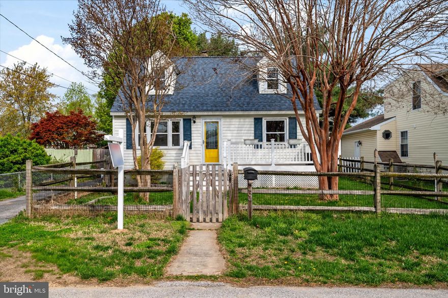 Welcome to the water-privileged community of Riviera Beach! Coastal Charm found here: this Cape Cod boasts bright natural light and original hardwood floors. Inside you'll enjoy four spacious bedrooms and two full baths. Main level living and more! Outside, relax on your front porch with your morning cup of coffee, or gather around the fire pit in the fully fenced backyard with family and friends. The bonus sunroom caters to the indoor/outdoor living this location has to offer. Move in ready. Fully available to tour in April with plenty of time to plan the first barbeque of the summer.