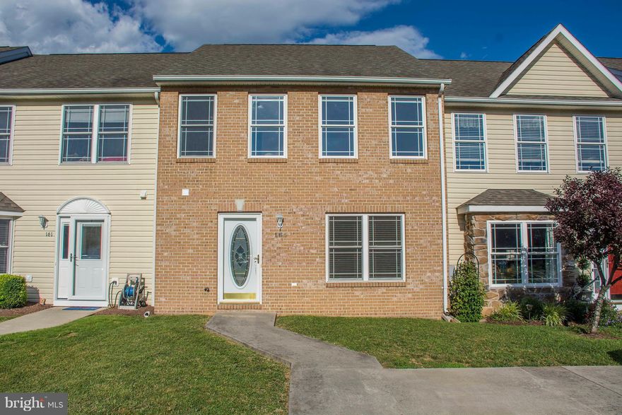 RENOVATED AND MOVE IN READY two level townhome at Locust Hill Golf community with rear patio which backs to the golf course.   Home features brick front and concrete driveway for private parking plus additional guest parking. Ready for quick move and priced to sell with new carpet and fresh paint.  Large master with en suite and vaulted ceilings! Great views, recently REDUCED, and ready to go!