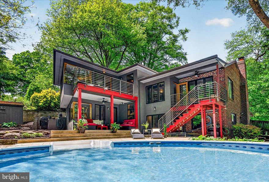 This gorgeous mid-century modern gem is truly one of a kind. The location is unbeatable: set on a serene, .27 acre cul-de-sac lot that backs onto the stunning vistas of Gulf Branch Park. With a trailhead entrance just at the end of the street, you are immersed in nature, yet only minutes from DC, public transportation, and less than 10 miles from the airport. The property is located in the Jamestown, Williamsburg, and Yorktown school pyramid.

The residence itself won the Arlington Design Award in 2013, having been meticulously curated by designer Wanda Madrid-Diaz (wmdesign.us). The interior offers flexible, spacious living with four distinct bedrooms. The layout features a main-level living room and a lower-level family room, plus two additional versatile rooms perfect for home offices, guest quarters, or hobby spaces. The expansive, open kitchen serves as the heart of the home, featuring a peninsula-style counter and a bright eat-in area. All bathrooms have been updated in the last 2 years. 

Embracing a classic mid-century aesthetic, the home pairs a crisp white palette with bold primary accents, hardwoods, exposed beams, and original brick. Just off Old Glebe Road, this neighborhood is highly sought after for its mature trees, rolling hills, and proximity to the Potomac River. Expansive windows frame views of the lush backyard, which features a gorgeous patio, multiple decks, and a unique circular pool. Whether it's the blooming flowers of spring, the vibrant foliage of autumn, or the quiet snowfall and visiting deer in winter, the home offers a front-row seat to every season.

Both primary living areas boast wood-burning fireplaces, providing elegant focal points for chilly evenings. The fully finished walk-out basement offers endless possibilities for recreation. Outside, the expansive deck and patio are ideal for summer barbecues or quiet evenings under the stars. Complete with an attached garage and a driveway that accommodates multiple vehicles, this property perfectly balances luxury, convenience, and an enviable lifestyle.