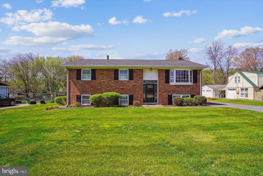 This well-cared-for, one-owner home is a rare find in the heart of Howard County, offering space, functionality, and a convenient location just minutes from the historic charm and shops of Savage Mill.

The main level features three bedrooms and two full bathrooms, along with a light-filled living room, dining room, and kitchen, all highlighted by well-maintained hardwood floors. The kitchen walks out to a sizable, low-maintenance deck—perfect for cookouts, outdoor gatherings, or simply enjoying your morning coffee with a view of the backyard.

Downstairs, the finished lower level adds tremendous versatility. There’s a cozy family room with a wood-burning brick fireplace, a fourth bedroom, a bathroom, and a bonus room that works well as an office or extra storage space. The large utility/laundry area offers even more space—ideal for a workshop, storage, or creative use—with walkout access to the rear yard.

One of the home’s most impressive features is the oversized two-car detached garage. With extra depth and width, there’s plenty of room for parking, a workshop, hobby space, or storage. The expanded driveway and parking pad can comfortably accommodate four to six additional vehicles.

The home has been freshly painted throughout, and the roof was replaced in 2015 with architectural shingles.  Updated 200 amp electrical service.  While being sold AS-IS, it has been lovingly maintained and is believed to be in good condition.

With quick access to major commuter routes including Route 32 and Route 1, this property is perfectly situated for those who want to enjoy peaceful suburban living while staying close to the essentials.

Buyers with a vision will appreciate the opportunity to personalize and update the kitchen and baths to build instant equity. Don’t miss your chance to make this solid, spacious home your own!