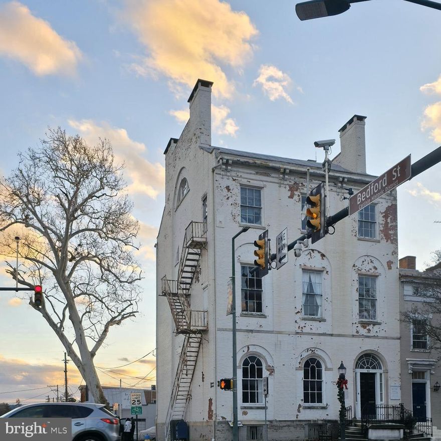 The Historic Duncan-Stiles House was built in 1811 as one of the most expensive, largest, single-family homes ever built in Carlisle. This landmark gem now boasts businesses and apartments on a downtown pedestrian thoroughfare. It retains many of its original details, woodwork, marble, and extravagant beauty! This historic staple has 5 Commercial Suites on the 1st and 2nd levels which feature the original hardwood floors, chandeliers, large windows, and gorgeous original curved wood doors. There is a 1-bedroom apartment located in the basement. Parking Lot in the rear has 5-6 spaces available. The 3rd and 4th floors need some TLC. It would make a spectacular 2-bedroom 2-story apartment for a live-in business owner! They are also perfectly suited for 3 more apartments adding to your rental income! Two 1-bedroom apartments and one studio apartment (Owners have Design plans and Estimates available upon request). Don't miss out on your opportunity to own the Duncan-Stiles House, a piece of landmark history in downtown Carlisle!