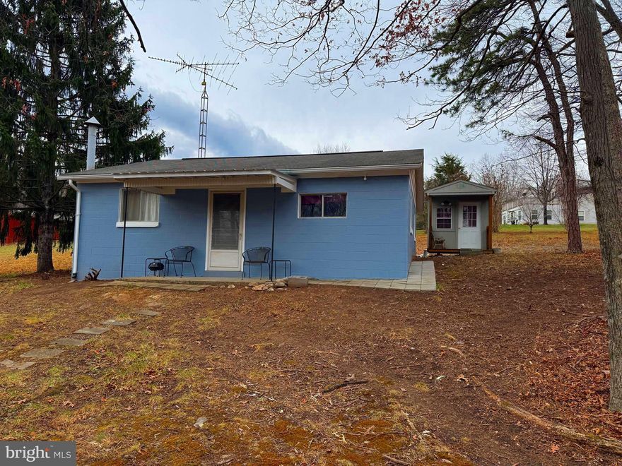 Forget the tent and cramped camper ... Clamping at its best.   Hunt, Fish, Hike or just get away.  This property consist of 3 lots with 2 bedrooms,  a kitchen and living room.   There is also a room for a future bath.  The Bath House is just across the road for your convenience and Short Mountain access is just a short hike away with 8,000 acres of Public Land.  Take just a few steps  and within view,  you will find the community pond.   Hampshire county also has several public river access' for the water enthusiast.  All this is located about 2 hours from the DC area.  Grab this  now and be ready for Summer fun and Hunting Season.  Come to WV and Bag that Buck, score that Thanksgiving Turkey, Shoot that Black Bear or take a Hike.  Historical Hampshire County has much to offer.