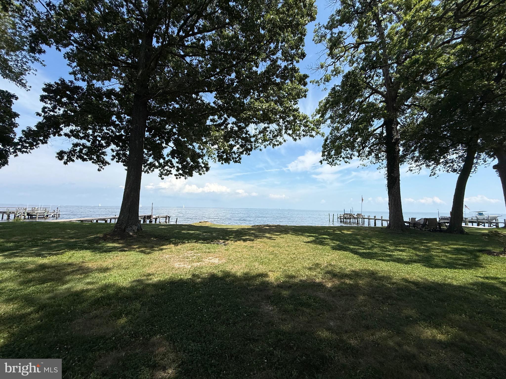 •••Offer Deadline Monday Aug 11th at 9am••• Incredible Opportunity to Own Direct Waterfront with Unobstructed Million-Dollar Views of the Chesapeake Bay! Located in the highly desirable North Beach area, 45 Minutes to Annapolis & just 45 minutes from Washington, D.C. this property offers the perfect balance of coastal charm and commuter convenience. Enjoy close proximity to Herrington Harbor South Marina, waterfront dining, shopping, the boardwalk, and beach access. The existing 1930s cottage offers over 1,500 square feet with 2 bedrooms and 1 full bath and requires a full renovation on this rare doubl. Whether you choose to restore its vintage character or start fresh and build the waterfront home of your dreams, the potential here is endless. Don’t miss this rare chance to own a slice of the Bay lifestyle in a prime location! No flood insurance Required! ••Seller prefers Maryland Trust Title & Escrow••
Seller and listing agent do not warrant any statements regarding a pier being able to be built. Buyer needs to do their own due diligence by going to AAcounty website > Inspections > Permits > Resident Permit > Structures > Residential Lots > Piers > Permits Checklist