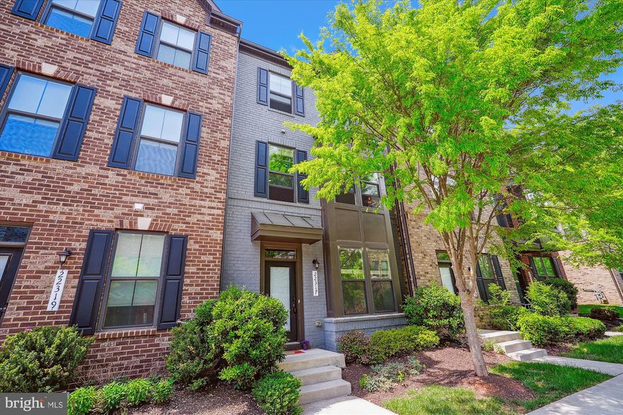 **Price has been reduced by $50,000. **
Step into a world of sophistication and timeless style in this impeccably appointed 4-bedroom, 3.5-bath luxury townhome, ideally positioned in the exclusive Westmoore at Moorefield.  Masterfully designed with both comfort and opulence in mind, high-end finishes, gracious living spaces, and exceptional attention to detail at every turn.
The versatile entry level suite, complete with a full bath, offers the perfect retreat for discerning guests or an elegant home office. Rich hardwood flooring flows seamlessly throughout the entry and main levels, setting the tone for the refined interiors that await. 
At the heart of the home, a gourmet kitchen awaits, an entertainer’s dream, featuring a statement center island, generous dining space, and sophisticated finishes that blend form and function with effortless grace. The open-concept layout flows seamlessly into a private, enclosed covered deck, your year-round sanctuary for al fresco dining and serene relaxation.  
Every element has been artfully curated, from designer lighting with dimmers to fully renovated bathrooms, each adorned with sleek, contemporary touches. The sumptuous primary suite offers a true haven of indulgence, boasting dual vanities, twin showerheads, and an expansive walk-in closet.  
Innovative living meets understated luxury with premium upgrades including a whisper-quiet Bosch dishwasher, high-efficiency water heater, Ecobee smart thermostat, and a state of the art LG washer and dryer enhanced by AI technology. The attached two-car garage, with driveway parking for two additional vehicles, as well as ample unassigned guest parking, ensures convenience for both everyday living and upscale entertaining. 
Residents enjoy access to an array of amenities: meandering trails, a picturesque lakefront clubhouse, a state of the art fitness center, a sparkling pool, lush parks, playgrounds, dog parks, and an enchanting outdoor amphitheater, perfect for summer evenings under the stars. 
Tucked along a peaceful, tree-lined street just a 10-minute stroll from the Ashburn Metro Station (Silver Line), this refined residence offers effortless access to Northern Virginia’s premier destinations. Indulge in upscale shopping and dining at One Loudoun and Brambleton Town Center, or savor the richness of Virginia's  wine country, where the Brambleton Farmers Market overflows with local fruits, vegetables, and small-batch vintages from nearby orchards and vineyards.