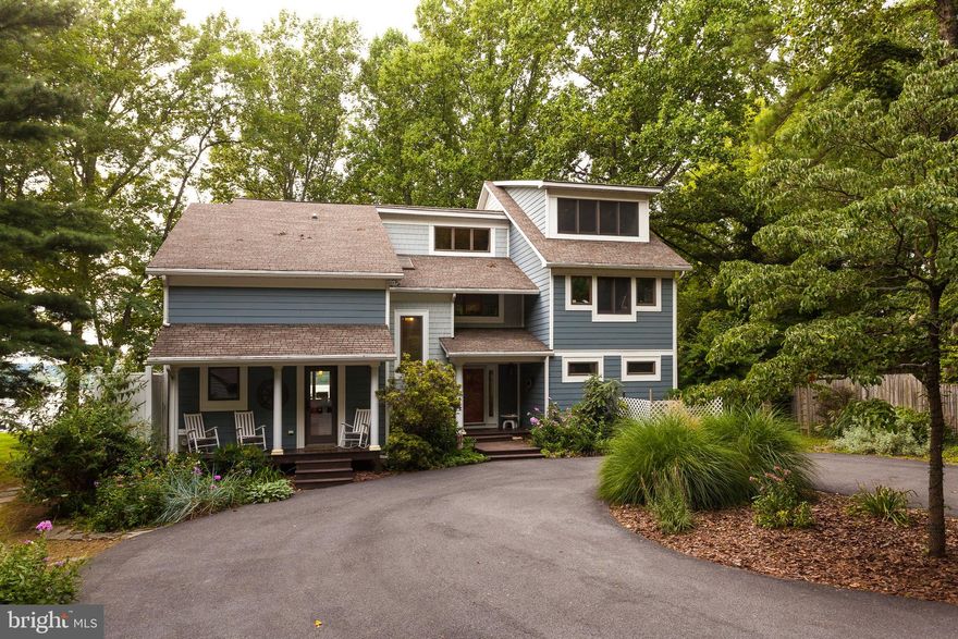 Spectacular sunsets on the Elk River! If you want a waterfront life, this is the location. Let's start outside: dock with 1 boatlift and 2 jet ski lifts; two levels of river front decks with built in storage for all your water toys along 100' of beach, a floating dock, and kayak rack for 4-6 kayaks. And did you see the cool Surf Swing? Watch the osprey and eagles overhead as you shower the river off in the outside shower.  Finish your day enjoying the sunset on the wrap around deck as you watch the big ships cruise to and from the C & D Canal. Paved driveway leads to a home located on 1.6 acres affording privacy, and peace and quiet. Come on inside! This home features open plan with large modern kitchen, dining area, living room with cathedral ceilings and downstairs studio/office/study, all with expansive views of the river. Wrap around window seats in the living room give you hidden storage and lots of space to lounge around or entertain. In the winter cozy up to the fireplace that opens into 2 rooms. Home features 2 zones for heating/cooling for efficiency and comfort. Second floor features master bedroom and bathroom, 2 bedrooms, 2nd full bath, and loft overlooking the living room . A fourth room upstairs can be a study, office, or another bedroom. The entire 3rd floor is a recreation room, featuring a wall size entertainment unit. This is the one you've been looking for! Roof, heating/cooling system, siding and most of floors were updated in 2008.