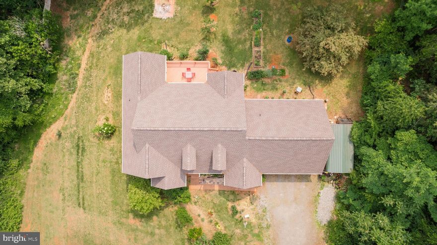 Amazing brick rambler on 3+ acres with gorgeous mountain and farmland views in a community with no HOA.  This home has a huge open floor plan with an abundance of natural light and vaulted ceilings.  There is a separate formal dining room/library space.  The Basement is mostly finished with a large unfinished area equal to the oversized garage that can be finished, used as a workshop, or storage.  The whole house central vacuum system makes cleanup super simple. This home has several accessibility features including a roll-in entry from the garage and a chairlift for basement access.  The current owners' favorite thing about this property is the beautiful view, stunning sunsets, and peaceful surroundings.  Roof and HVAC replaced in 2022.