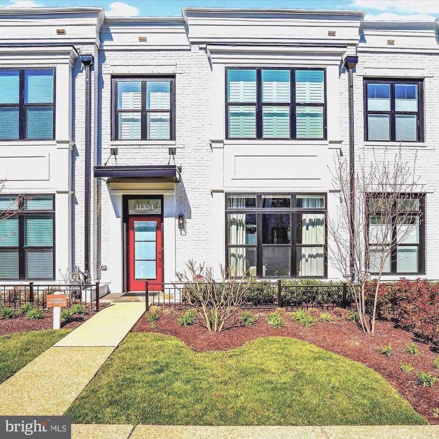 Welcome to this gorgeous,  4 level garage townhome located in the newly revitalized Cabin John Village. No need to wait for your new home to be built, this less than 3 year old home offers all of the options you would desire, and is move in ready. Enjoy the convenience of stepping out to either the walking trails of Cabin John Park, or to the array of many new restaurants, and an abundance of shopping, services and businesses. This home is ideally located at the PARK end of the community, offering a view of trees from the rooftop terrace. From the moment you walk into this home, you will be awed by the gorgeous statement wall with gas fireplace, and then onto the beautifully designed kitchen with high end Wolf and Bosch appliances, and a large quartz island for all to gather. This Cypress model, built by EYA is approximately. 2700 sq ft, has 4 Bedrooms, 3 full Baths and 2 Half baths. The loft level with custom built-ins and bar, and large glass door to rooftop terrace is the ideal entertaining space. Create your oasis with seating and a fire pit protected from sun and rain with an by an added retractable awning. This level also has and additional bedroom and full bath.  The lower level has the entrance from the 2 car garage, recreation/workout room, additional powder room and lots of storage.  So many upgrades including; kitchen design and appliances,  statement wall with gas fireplace, custom built-ins and closets, luxury flooring, custom window treatments throughout, recessed lighting, plus more. Come enjoy all the conveniences and location this home has to offer.