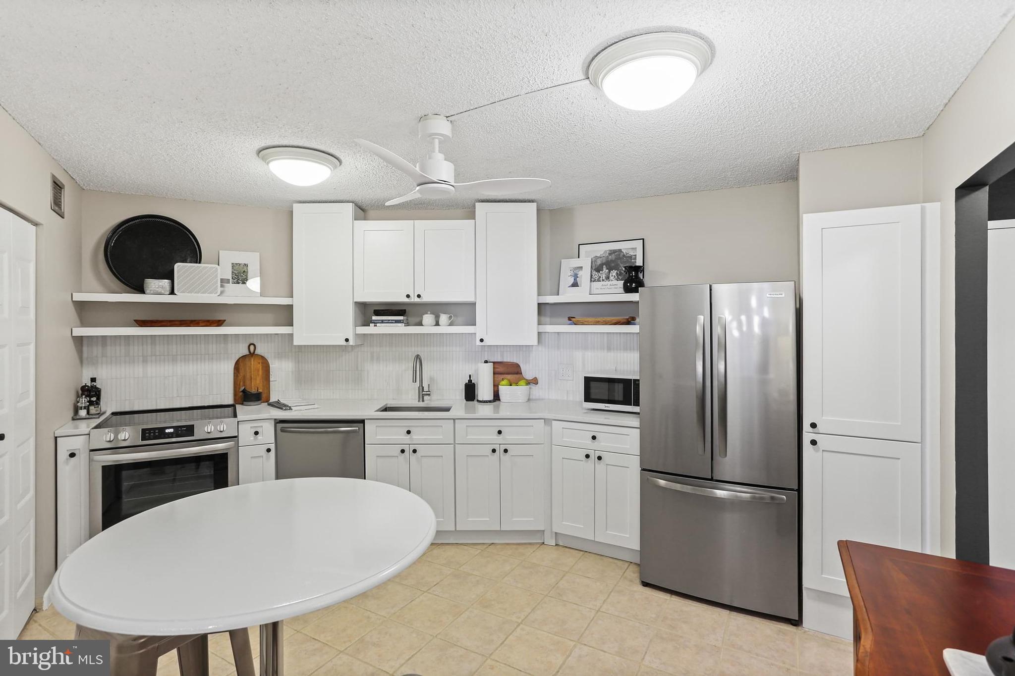 Welcome to The Ridgely! This renovated 19th-floor 1BR/1BA condo offers 1,121 sq. ft. of stylish living in the heart of Towson. Enjoy panoramic southwest views and breathtaking sunsets from your spacious private balcony. The renovated chef’s kitchen features custom soft-close cabinetry, quartz countertops, a marble backsplash, stainless steel appliances, and a custom pantry. Open living and dining areas are perfect for entertaining, complemented by in-unit laundry, new lighting, and custom window treatments. The spacious primary suite boasts a walk-in closet system and an updated bath with marble/tile accents, a new vanity, and a spa shower head. Recent upgrades also include new AC units and ceiling fans. The Ridgely provides 24-hour concierge, fitness center, heated pool, resident lounge, garage parking, and more. The condo fee covers AC, heat, water, trash, sewer, and security. Conveniently located within walking distance to shops, businesses, dining, Whole Foods, a cinema, the farmers market, and nearby college and universities. This condo is truly turnkey and available fully furnished at an additional cost. Schedule your private tour today!