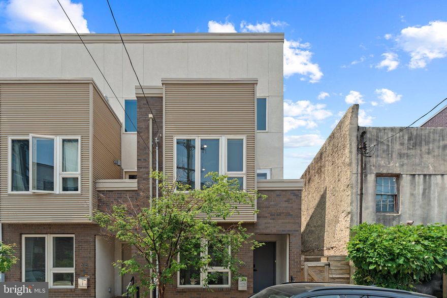 A modern aesthetic, abundant space, and a fantastic location in the heart of Northern Liberties make 618 N American St a standout! This 3-story home offers 3 bedroom suites with 3 full bathrooms, a finished basement, and multiple outdoor spaces, including a private patio and a roof deck. A quiet, low-traffic block leads to the towering facade that blends brick, siding, stucco, and glass. Through the recessed entry, you're welcomed inside by a raised foyer with mudroom-style coat hooks on a board and batten wall. Soaring ceilings and gleaming hardwoods frame the bright, open, and airy main level. The living room boasts plenty of space for entertaining, a second feature wall, and great natural light from tall windows. Past the center staircase, there's a sunlit dining area and a brand new sleek kitchen fitted with white shaker cabinetry, quartz waterfall counters, plus all new stainless steel appliances, a tile backsplash, and breakfast bar seating. Out back, the large wrap-around patio is sure to be a popular spot for summer barbecues, gardening, and dining under the stars. More living space is found in the large finished basement with brand new flooring that could be used for a home theater, a playroom, or a gym. Up on the second level, two bedroom suites featuring a wall of windows, custom closets, and modern full bathrooms sit on opposite ends. The third level is dedicated to the primary suite. There's a bright, spacious bedroom with sliding doors that open to a terrace, a pair of walk-in closets, a laundry closet, and a luxurious bathroom boasting a floating double vanity, a glass-enclosed shower, and a private water closet. Topping off the home is an expansive roof deck ideal for hosting family and friends. 618 N American St's sought-after location earns a Walk Score of 93! The Market Frankford line station is only 3 mins away. There's also easy access to I-676, I-95, and South Jersey. Northern Liberties is a thriving neighborhood filled with top-rated restaurants, friendly shops, and lively entertainment. Playful parks are close, and neighboring Fishtown has lots more to explore .Schedule your showing today!