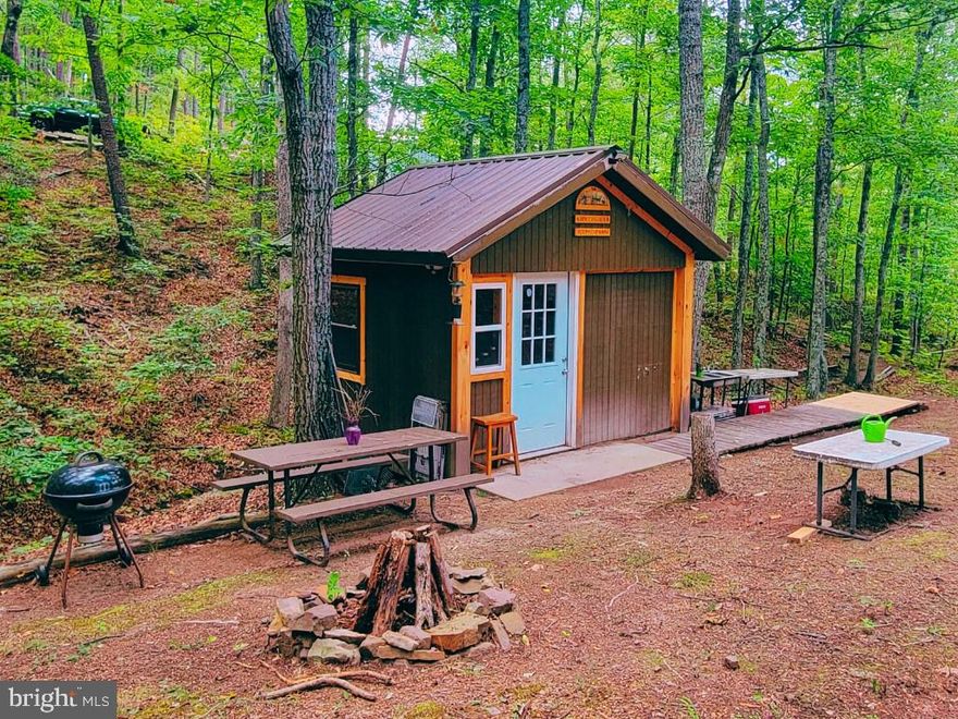 Have you been dreaming of a little land in the mountains of WV complete with primitive cabin? This 3.6 acres off the hard-top road just 2 minutes from Rt 50 in Augusta is calling your name. Enjoy hunting, camping, and relaxing THIS year. Property backs to 40 undeveloped acres. Bear, deer, and turkey are frequent visitors. Wet weather stream runs through, just behind the cabin. Gas Station is just 2 minutes away; Short Mountain Wildlife Management Area is a 20 minute drive; Winchester, VA is 30 minutes; Capon Bridge, WV offers restaurants, small retail stores, and plenty of entertainment at just 10 minutes away. Future permanent home potential exists with septic reserve on recorded plat. Locked gate, no drive-bys.
