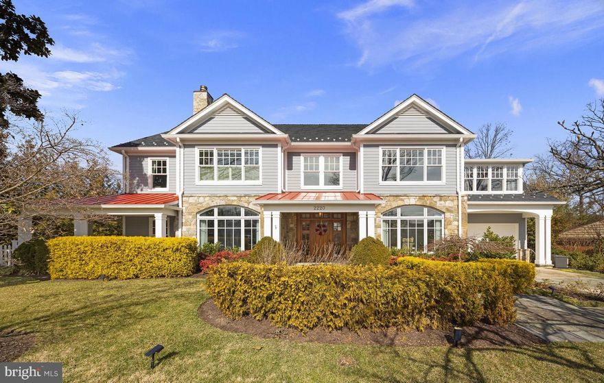 Experience luxury living at its finest in this extraordinary Belle Haven residence, where timeless elegance meets modern sophistication. From the moment you arrive, the home’s unmatched curb appeal and professionally landscaped grounds set the tone for what lies within.

Step inside to a stunning grand entry foyer that opens to beautifully appointed formal living and dining rooms, perfect for both intimate gatherings and large-scale entertaining. Rich wood floors, recessed lighting, exquisite moldings, and a built-in speaker system enhance the home’s refined ambiance. The inviting living room, anchored by a fireplace, creates a warm and welcoming atmosphere.

At the heart of the home is a true gourmet chef’s kitchen, thoughtfully designed with two-toned cabinetry, a massive center island, and top-of-the-line finishes. A fully equipped butler’s pantry, custom mudroom, and sun-filled breakfast area flow seamlessly into the spacious family room, complete with a striking stone surround fireplace—making this home an entertainer’s dream.

The main level also features a private office, ideal for today’s work-from-home lifestyle.

Upstairs, the luxurious primary suite offers a serene retreat with a sitting area, fireplace, modern lighting, and a spa-inspired ensuite bath featuring dual vanities, a soaking tub, a walk-in shower, and two expansive walk-in closets. Three additional bedrooms, three full bathrooms, a den, and an additional home office complete the second level.

The top level provides incredible versatility with a large recreation space—perfect for a playroom, home theater, or lounge—along with an additional bedroom and full bath.

Outdoor living is equally impressive, with a fully fenced, flat backyard, a covered wraparound porch, and a slate patio with a built-in firepit—ideal for relaxing or entertaining year-round.

Built by one of the area’s premier custom builders and thoughtfully refreshed in 2017 under the direction of acclaimed DC designer Zoe Feldman, the results are nothing short of spectacular.

The home’s superior craftsmanship is evident in its stone and Hardi exterior, metal roofing, and expansive windows and doors that flood the interior with natural light. The professionally landscaped grounds are enhanced by elegant stone patios and walkways.

Notable features include an exceptional chef’s kitchen, butler’s pantry, and mudroom, three fireplaces, two private offices, soaring ceilings, intricate trim work, wide plank flooring, extensive custom lighting, and integrated Sonos sound throughout much of the home. Every detail has been meticulously curated.

Five spacious bedrooms include the luxurious primary suite, complete with dual walk-in closets, a sitting area, gas fireplace, and spa-like bath. Custom glass doors seamlessly connect the interior to the outdoor living spaces, which feature an expansive wraparound stone patio, built-in gas firepit, and a covered veranda overlooking a private, level lawn framed by a charming white picket fence and a row of mature privacy trees.  Additional features include a one-car garage. 

Recent upgrades, including a new HVAC system, tankless water heater, and a 20 kW whole-home generator, ensure turnkey convenience and modern comfort. Additional updates include all new carrier hvac and heat pump, spray foam insulation entire upstairs, roof and crawl spaces, upgraded ductwork and dampers, renovated crawl space to allow for storage in the loft, custom Granilux security systems with cameras, and custom built wine cellar that holds just under 1,000 bottles.

One visit is all it takes to understand why this remarkable property is considered one of Belle Haven’s most notable homes.