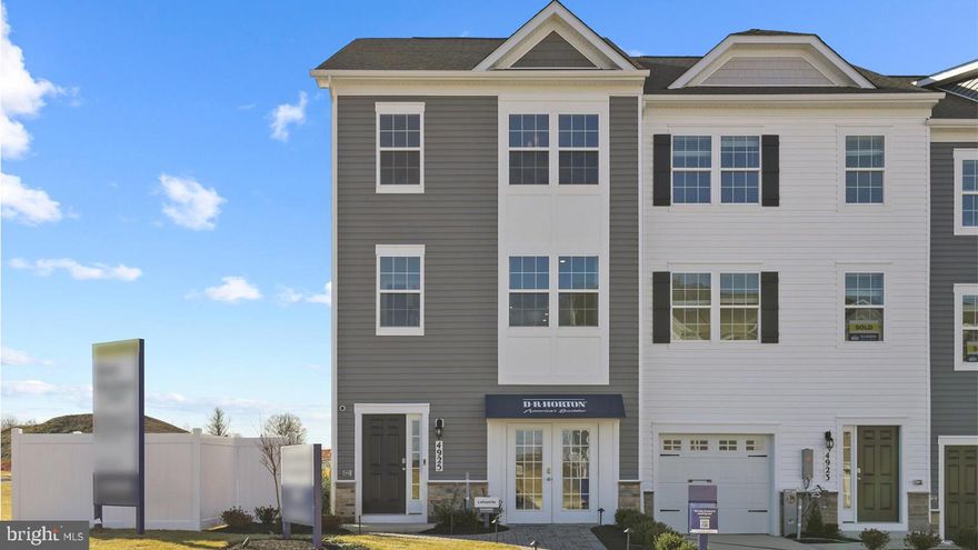 New Home ready for a Spring 2026 closing! This town home will be in an ideal location with quick access to I-95 and 695!   The Lafayette features 3 bedrooms, 3.5 baths, and a finished rec room (with an option of converting to a den) that can double as a 4th bedroom along with an additional full bath. Thoughtful design is uniquely embodied in this town home plan, which features 1,969 sq ft of living space. This home offers a spacious rear main level eat-in kitchen with upgraded gray cabinets, quartz countertops and stainless-steel Whirlpool appliances. Recessed lighting and blinds are provided throughout the home as well. Hard surface flooring is included on the entire lower and main levels, to offer modern luxury and contemporary appeal. The third level features a luxurious primary suite with a large walk-in closet and a spacious double vanity primary bathroom. Also on the third level are two secondary bedrooms, upper-level laundry, and hall bathroom which also includes upgraded gray cabinets and a quartz countertop. Simplify your life with D.R. Horton's smart home technology which includes a key-less entry, Skybell (video doorbell), programmable thermostat to adjust your temperature from your smartphone and much more!  The curb appeal of this home boasts an urban and modern feel that is sure to stand out. It is conveniently located across the street from tons of shopping and entertainment options. Incredible rates and closing incentive options available with the use of DHI Mortgage.