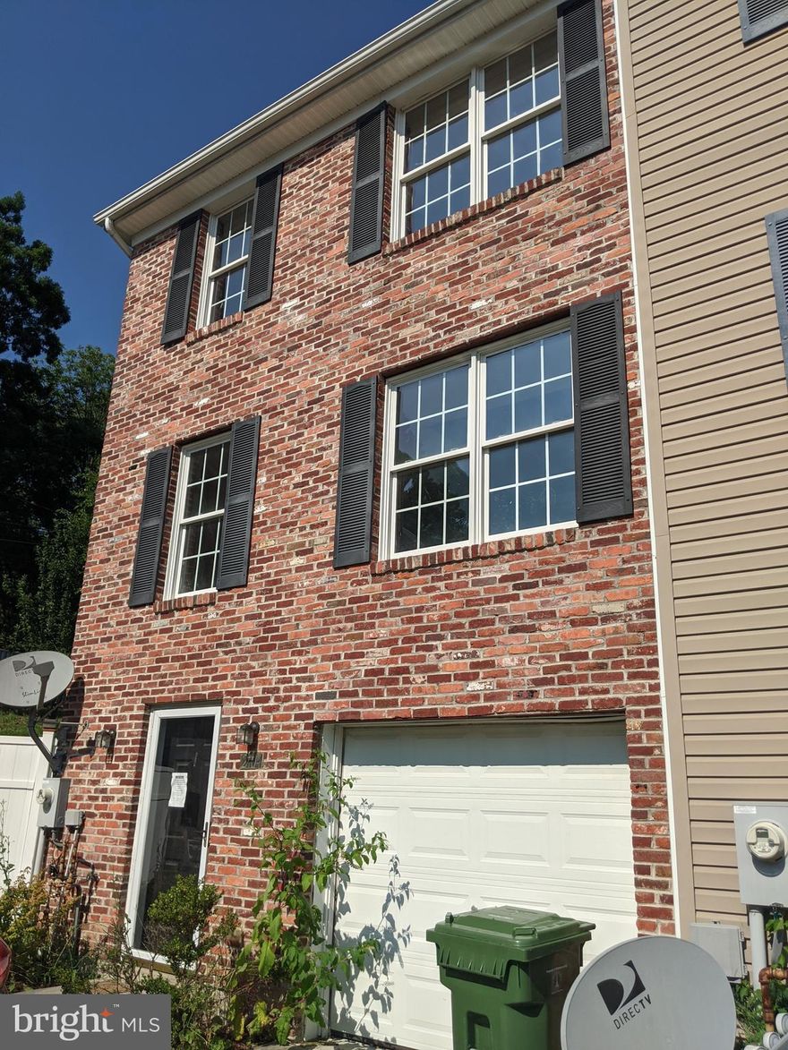 CASH or REHAB loans only! A great value to be had.  Built in 2005 this 3  level garage townhouse is waiting for a new owner to make it their own! It needs work  and should be able to be done with a FHA 203K streamline loan.  Some drywall work,  carpentry, paint, flooring and some plumbing  is needed.  Kitchen and baths are intact and they should just need a good cleaning! The ground level has a family room with a gas fireplace and access to the 1 car garage. The main level  has a large living dining room and an eat-in kitchen with sliders to a rear deck. The upper level has 3 bedrooms and 1 bath. SOLD as-is. Buyer to pay ALL recordation & transfer taxes.