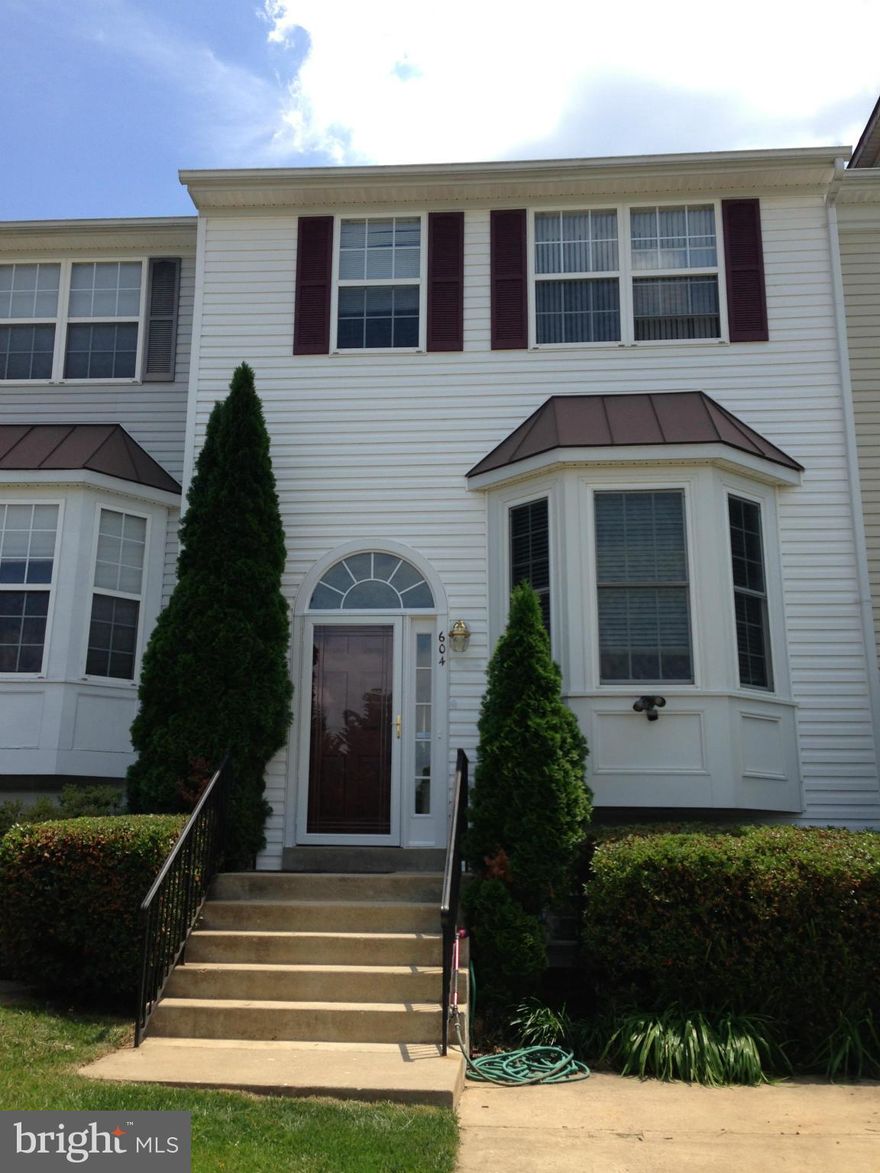 Spacious 3 finished level town house in great location.  Kitchen with ceramic tile floors and bay window. Chair rail and crown molding. Brick patio, fenced yard. Freshly painted. New Trane air conditioner, new hot water heater, new front storm door.