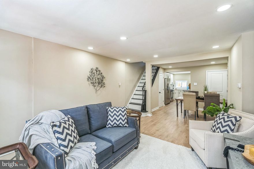 Welcome to 416 Dudley St, a beautifully renovated home in the heart of South Philadelphia. Step inside to discover an open main floor featuring brand new laminate wood flooring and a modern kitchen outfitted with white shaker cabinets, granite countertops, stainless steel appliances, and stylish hardware. Upstairs, you'll find two spacious bedrooms with matching new flooring. The primary suite includes a private bathroom with a unique vanity and a ceramic tile shower. An additional full bathroom has also been fully updated with contemporary finishes. For added convenience, the laundry room is located on the second floor, making laundry day a breeze. This home offers modern comfort in a classic South Philly setting—schedule your showing today!