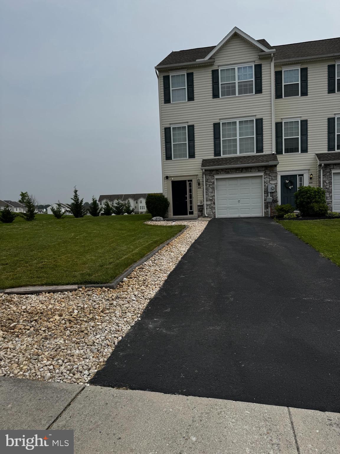 Wow what a yard for a townhouse! End of unit with 3.5 bathrooms. 3 or 4 bedrooms. Lower level is great as a bedroom, family room, or den. One car garage. Deck and much more. Sellers are 75% moved out. Back on the market due to buyer not being able to get their home sold in time.
