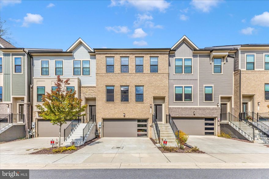 BETTER THAN NEW townhome Located in the sought-after Watershed community, this fashionable 3 level townhome blends luxury features and comfort in a  beautifully designed living space. A true PREMIUM location within the community, this home backs to a luxuriously private of mature hardwood trees.  Very few homes in this community have that benefit.  Enjoy a stylish kitchen with bright windows overlooking the rear view. Espresso contemporary cabinets topped with Quartz, stainless steel appliances, and a large center island that opens to the dining and gathering rooms. Upstairs, the owner’s suite features a walk-in closet and spa-inspired bath with dual shower heads all overlooking that unique private view of peace.  Two additional bedrooms and hall bath complete the upper level. The fully finished walkout lower level allows plenty of space for a home office, gym, or guest suite. The 2 car garage is a convenient front entry with stair to the main level of the interior.  Gutter guards installed in 2021. This home is in pristine condition.  Watershed residents enjoy resort-style amenities including walking trails, playgrounds, pools and a clubhouse all just minutes from major commuter routes, shopping, and dining.