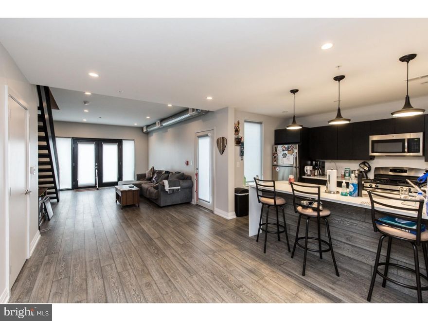Available early July:

Welcome to 512 E Girard Ave #104! This gorgeous 2 bedroom / 1.5 bathroom bi-level unit offers a wide open floor plan, THREE outdoor spaces, & luxurious finishes! Enter into the common area with hardwood floors, recessed lighting, exposed spiral ductwork, and plenty of room for different furniture set ups. The patio doors flood the space with natural light and this great apartment features TWO private patios on the main level, as well as shared access to the building's HUGE roof deck! Head over to your kitchen to view quartz countertops, cabinetry above & below, stainless steel appliances, and an island for extra prep space & counter seating. Continue to the second floor to view 2 sizable bedrooms, both featuring hardwood floors & ample closet space. Your sleek bathroom boasts tile flooring, subway tiling along the walls and surrounding the shower / tub, and a dual vanity with overhead lighting. There is in-unit laundry for ultimate convenience, and building amenities include storage lockers and bike storage in the basement, as well as an expansive roof deck with 360 degree views of the skyline and Ben Franklin Bridge. This great space won't last long- schedule your tour today!

About the Neighborhood:

Nestled in the heart of Fishtown, you'll have tons of shopping, restaurants, and entertainment right outside your door! Walkable to The Fillmore, Brooklyn Bowl, Fabrika, Penn Treaty Park, Hetzell Playground, and Palmer Park. Close proximity to I-95 and surrounded by plenty of public transportation options for a quick & easy commute. You'll want to check out local neighborhood favorites like Lloyd, Interstate Drafthouse, Barcade, Frankford Hall, Milkcrate Cafe, Johnny Brenda's, and countless more!

Lease Terms:

Generally, first month, last month, and one month security deposit due at, or prior to, lease signing. Other terms may be required by Landlord. $55 application fee per applicant. Pets 30 lbs and under are conditional on owner's approval and may require an additional fee and/or monthly pet rent, if accepted. (Generally $500/dog and $250/cat, and/or monthly pet rent). Tenants responsible for: electricity, gas, cable/internet, and water.