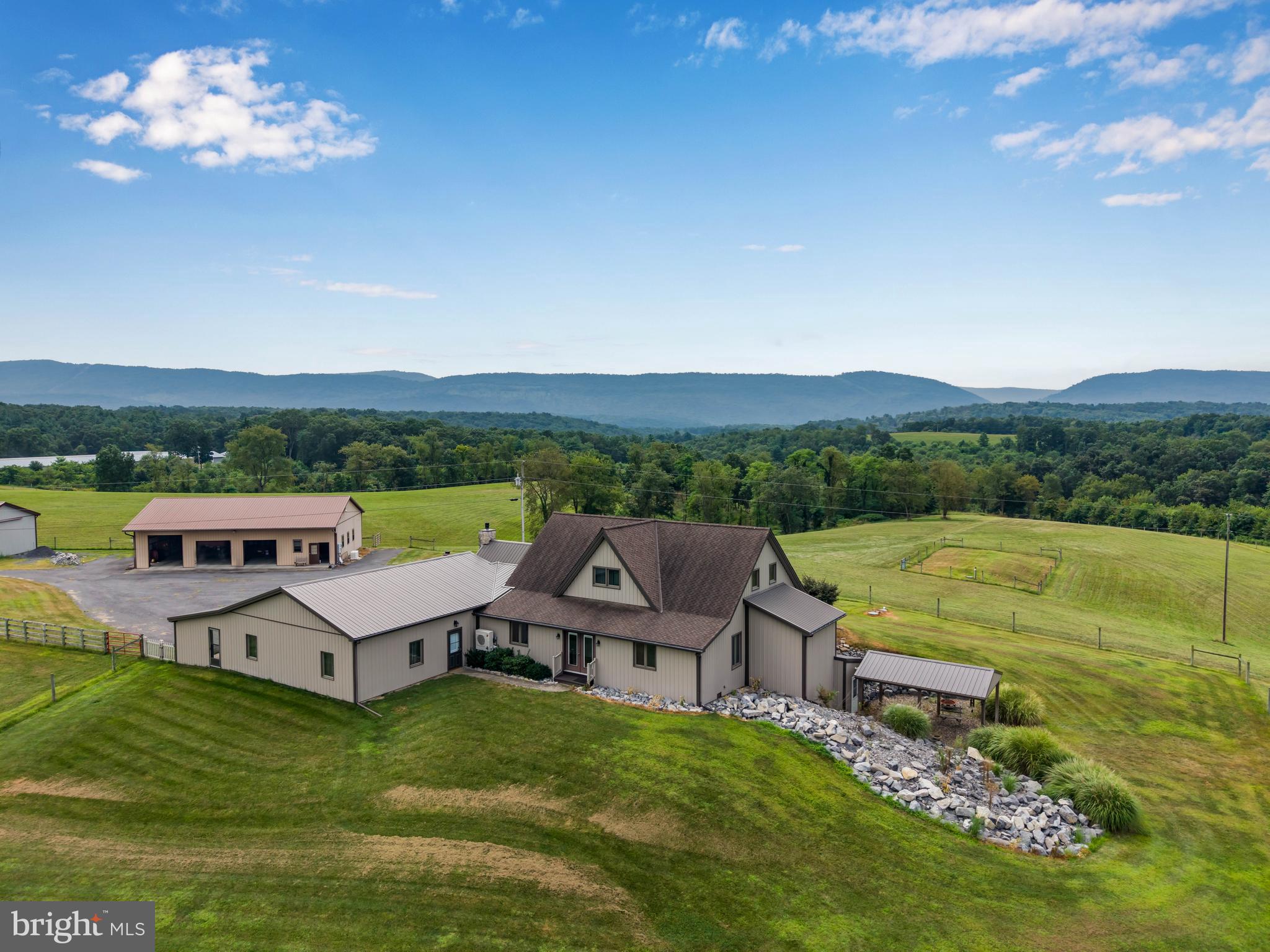 Stunning 58.88-Acre Farm with Home, Equestrian Facilities, and Breathtaking Mountain Views – Honey Grove, Juniata County (Do NOT walk property without an agent or an appointment).
- Discover the perfect blend of country charm, modern comfort, and agricultural opportunity on this 58.88-acre farm in the scenic heart of Juniata County. Situated in the quaint community of Honey Grove, this property offers endless possibilities for farming, equestrian use, recreation, and more — all surrounded by sweeping mountain views.
Property Highlights:
- Land & Fencing
- Total acreage: 58.88 acres
- Over 35 acres fenced, ideal for horses, cattle, or other livestock. Pasture 31 acres, 28 wooded acres.
- Beautiful pastureland plus productive, farmable acreage for crops or hay production.
- Abundant wildlife and excellent hunting opportunities right on your property
- Equestrian & Agricultural Facilities
- Three metal barns offering versatile storage and work space
- Tack room with dedicated space for saddles and equipment (kitchenette)
- Existing horse stalls plus room to add up to eight more
- Large open areas for riding or training
- Expansive storage for farm equipment, hay, and feed
Residence
- Built in 2006, this well-maintained home blends comfort and functionality
- Updated kitchen with modern finishes, ideal for home-cooked meals after a day on the farm
- Finished basement providing additional living, entertainment, or hobby space
- Large windows throughout to soak in the panoramic views of the surrounding mountains and farmland
Garages & Parking
- Oversized 2-car attached garage with plenty of storage space
- 3-car carport for additional covered parking
- Massive detached garage capable of holding up to 8 vehicles or accommodating large farm machinery
- Expansive parking area for trucks, trailers, or guests
- Outdoor Enjoyment
- Peaceful rural setting with stunning mountain vistas in every direction
- Ample space for gardens, orchards, or expanding pastureland
Private and serene, yet only a short drive to local conveniences
Located in Honey Grove, Juniata County, this property is perfectly situated for those seeking a balance between privacy and accessibility. Enjoy the quiet beauty of rural Pennsylvania while still being within reasonable distance to Harrisburg, State College, and major routes.
Whether you’re looking for a working farm, a horse lover’s paradise, a hunting retreat, or simply a peaceful homestead, this property offers the land, facilities, and lifestyle you’ve been dreaming of.