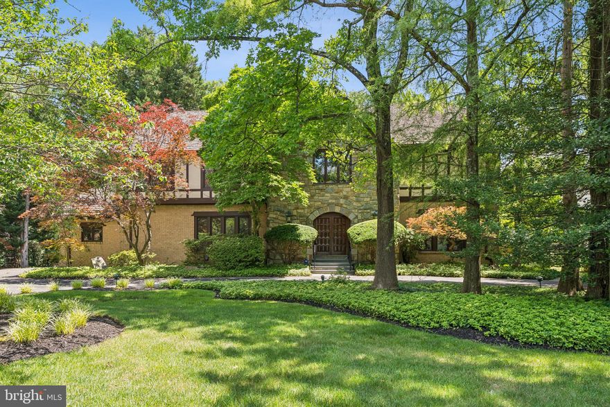 NEW ON MARKET! ANY OFFERS DUE BY 12 PM NOON on TUESDAY JUNE 24th. 
Prime location in Potomac Village! Welcome to this elegant, freshly painted custom-built brick and stone Tudor, situated on 2/3 acre on a quiet street, just a short walk to Potomac Village. Enter the spacious, two-story foyer featuring exquisite woodwork and staircase. The library/home office with built-in’s is located across from the expansive living and dining rooms, which can comfortably accommodate 12 or more dinner guests, providing an ideal setting for entertaining. A sunlit family room with a stone fireplace and built-ins opens to a large low-maintenance deck.  The renovated kitchen, equipped with high-quality cabinets, stainless steel appliances, granite countertops, and a large island, adjoins the generous four-season glass/screened porch with skylights. This porch opens to a circular brick and flagstone patio in the rear yard.  A formal powder room and laundry room complete the main floor.
The upper level features a large primary bedroom suite with an adjoining sitting room, three walk-in closets, and a spacious bath, along with four additional generously-sized bedrooms and two more full baths. Hardwood floors are present throughout both the main and upper levels. The walk-out lower level comprises a large recreation room, built-in wet bar, wine storage, two bedrooms/bonus rooms, and a full bath, as well as additional storage. Sliding doors provide access to a second ground-level flagstone patio, outdoor kitchen, and gazebo.
Adding to the charm, the community itself offers an exceptional quality of life, with highly rated schools just a short distance away. Potomac Village offers many conveniences: grocery stores, gourmet shops, diverse dining options (restaurants, coffee shop, pizza parlor, ice cream shop), a hardware store, beauty salons, library, banks, post office, professional services, and a bus to Friendship Heights Metro. Welcome home!