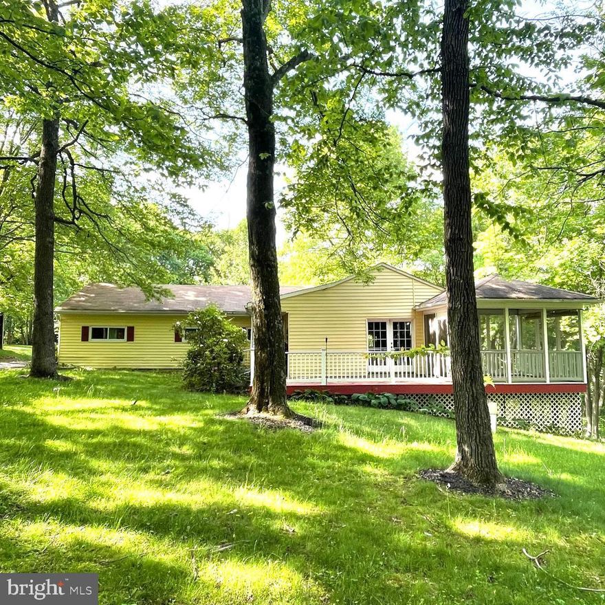 This one level living is great in this massive rambler on a huge 1.64 acre lot.  Great opportunity to update as you go, do a rehab or investor special.  Needs to be rehabbed so it can shine with your unique touches.  3 bedrooms & 2 full bathrooms.  Kitchen is open to the dining room & has table space.  Living room off kitchen w/ huge window with lovely views.  Master bedroom has it's own full bathroom.  Two other bedrooms w/ full bathroom in the hallway.  Sunroom in the back is great for plants & relaxing.  Huge family room w/ sliding glass doors leading to the porch.   Backyard is very serene & has plenty of space.  Shed goes with property.  Plenty of parking the driveway is very long.   Roof was updated not sure the year.  Great opportunity to put your own updates to make it shine again.  As Is sale.