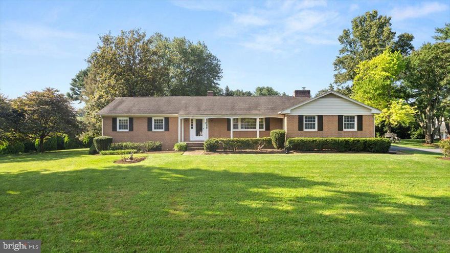 Welcome to 101 Dutton Place— Location, Location, Location! + One Level living! Nestled just inside the Frederick County line in the highly sought-after Merrimans Estates community. This beautifully maintained ranch-style home is ideally situated on a peaceful and meticulously landscaped 1.26-acre lot, minutes from WMC Hospital, downtown Winchester & major commuter routes!  
Step through the foyer and enjoy a tasteful, traditional layout designed for easy one-level living and seamless entertaining. This home features a spacious formal living room, formal dining room, and a cozy family room centered around a charming brick-encased gas fireplace. The gourmet kitchen is a true showstopper, complete with updated appliances, custom cabinetry, granite countertops, a large center island, and gas cooking—perfect for both casual dining and hosting.
Home boasts 3 bedrooms! Two generously sized guest bedrooms, a full hallway bath, and a serene primary suite with a private en-suite bath. The finished lower level adds approximately 870 square feet of additional living space, featuring a large great room, a flexible den area, and a dedicated laundry space.
Additional highlights include a side-load two-car garage with both interior and exterior access, mature trees, lush landscaping, and a newly installed drainfield as of May 2025. This is a truly special property that offers comfort, space, and timeless appeal in one of Winchester’s most desirable neighborhoods!