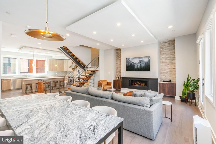 Welcome to the epitome of luxurious city living in the heart of Northern Liberties! This stunning luxury rental property at 609 N GALLOWAY ST embodies elegance and contemporary design. With its spacious layout and high-end features, it offers an extraordinary living experience. This home boasts an extra-wide, 24-foot lot providing expansive living spaces, a private 2-car garage, a finished basement, a roof deck with a wet bar, a chef's kitchen, and much more.

Upon entering this sophisticated townhome, you'll be greeted by a spacious foyer complete with a coat closet. This versatile space can be used for various purposes. Descending to the lower level, you'll find a large finished basement currently set up as a home gym.

Heading up the gorgeous wood floating staircase to the second floor, you'll immerse yourself in the seamless flow of the open-concept living, dining, and kitchen spaces, which extend to a welcoming balcony. The kitchen features upgraded contemporary cabinetry and is equipped with a collection of Wolf and SubZero appliances, including a commercial-grade range, a secondary wall oven, a built-in microwave, a paneled dishwasher, a wine/beverage refrigerator, and a counter-depth Sub Zero fridge. Adorned with Quartz countertops and an expansive subway tile backsplash, the kitchen also boasts a generously sized island comfortably seating up to four individuals, complemented by newly added accent lighting. The spacious living room offers a central gas fireplace framed by floating cabinetry and a custom stone backsplash. This top-tier fireplace includes a built-in heat deflector, allowing for the placement of a flat-screen TV above it, optimizing the extraordinary built-in surround sound system for an immersive cinematic experience during movie nights! The dining area features a beautiful light fixture and a millwork accent wall.

As you ascend the staircase to reach the owner's sanctuary on the third floor, you'll encounter a generously proportioned master bedroom filled with natural light from a wall of windows and offering access to a balcony. Your expansive, custom walk-through closet comes complete with a tailor-made closet organization system, ensuring ample storage space. The master bathroom is a lavish retreat, adorned with floor-to-ceiling marble tiles, a floating double vanity, a glass-enclosed shower, and a freestanding soaking tub equipped with an on-demand hot water heater to ensure a perpetually warm and inviting soak. You'll also discover a bonus room lined with gorgeous bookcases, versatile for use as a nursery, home office, or a 5th bedroom. Conveniently, laundry facilities are accessible from the hallway.

The top floor presents three generously sized bedrooms, each featuring thoughtfully designed and ample custom closets. An expansive bathroom showcases modern tile and vanities, and from this level, you'll have access to the rooftop deck, where panoramic city views await your enjoyment.

Don't miss this amazing opportunity to rent a true stunner in an incredible neighborhood. Enjoy easy access to great restaurants, nightlife, and major highways.