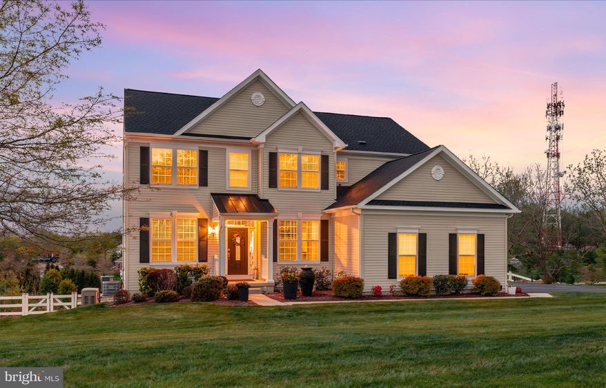 Situated in the picturesque cul-de-sac community of Heatherwynd East, 21 Lammey Way in Downingtown rests on over an acre of beautifully maintained grounds, offering breathtaking panoramic views and exceptional privacy. This remarkable residence has been extensively upgraded during the current owner’s stewardship, blending timeless elegance with modern convenience.

Thoughtfully enhanced for both luxury and comfort, the home features a new roof, gleaming hardwood floors throughout, and a new air conditioning system servicing the main level. The first floor showcases a living room, dining room, and a gourmet kitchen with new appliances, designed for both everyday living and entertaining, complemented by a butler’s pantry providing a seamless connection between the dining room and kitchen.

A sun-drenched breakfast nook with new French doors opens directly to the deck, creating a perfect flow for indoor-outdoor living—ideal for taking in the surrounding panoramic views. The adjacent open-concept family room is equally impressive, featuring a gas fireplace and soaring ceilings exceeding 20 feet, filling the space with natural light and a grand sense of scale. A half bath, coat closet, and a private office with French doors complete the first floor.

The upper level offers a beautifully appointed private retreat. The spacious primary suite features a large walk-in closet and a luxurious en-suite bath complete with a soaking tub, dual vanities, smart toilet, and a glass-enclosed shower. Three additional generously sized bedrooms provide ample closet space and flexibility for family or guests, complemented by a well-appointed hall bathroom with dual vanities. A convenient second-floor laundry room, enhanced with natural light from a window and custom built-in cabinetry, adds both functionality and ease to everyday living.

The finished lower level elevates the home even further, featuring in-wall speakers, a projector and projector screen, a fifth bedroom, a playroom, and a beautifully appointed full bathroom. With its walk-out design, sliding doors lead to a private patio, creating an ideal space for extended family, guests, or a young adult seeking added privacy and independence. Ample storage space further enhances the functionality of the lower level.

Designed for effortless living, the property also includes a whole-house generator and a fully fenced yard. Additional highlights include a whole-home water filtration system and an elegant outdoor fountain set within professionally landscaped grounds, enhancing the home’s curb appeal.

Located within the highly sought-after Downingtown Area School District, featuring the Downingtown STEM Academy, this home seamlessly blends refined living with everyday practicality in one of Chester County’s most desirable communities, conveniently located near all amenities with easy access to Rt 30, Rt 202, and the PA Turnpike.