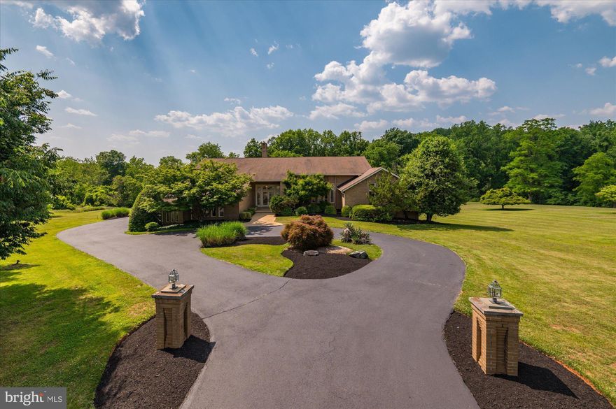 This custom-built home, close to Potomac Village, is located on 2 acs in the prestigious neighborhood of Tara, where the custom designed homes are sited on gently rolling lots with mature landscaping and trees. This home incorporates a floor plan with high ceilings, including several with skylights, large windows showcasing beautiful views, and a unique indoor garden that provide a dramatic interior while still being perfect for today's more relaxed lifestyle. The living room and dining room offer more formal spaces. The living room has a vaulted ceiling and offers access to a deck that spans the entire back of the house. The dining room is perfect for entertaining with a built-in buffet flanked by large storage closets. The den/library provides the perfect place to relax with a built-in walk-behind wet bar. The "heart" of the home is the large gourmet kitchen/family room divided by a two-sided, floor-to-ceiling stone fireplace with raised hearth and glass screens. The wall of windows and doors spans both the kitchen and family room, providing easy access to the deck. For those desiring a Primary Suite on the main level, there is a large bedroom with three walk-in closets, two ensuite bathrooms, and access to the deck. Adjacent to the bedroom is a study/office, which could easily become another bedroom with connecting full bathroom to the studio or gym. Completing this level are a powder room, laundry room with outside exit, and an oversized, three-car, side-entry garage. The upper level has three bedrooms and two full baths. The walkout lower level provides a myriad of finishing possibilities to suit your lifestyle. The second kitchen can easily be converted to a great wet bar area, and the recreation room with wood-burning fireplace could become a game room or media center. And there is still plenty of space for indoor soccer or basketball! Tara is the perfect neighborhood for those looking for custom-built homes on two acres close to Potomac Village with its shopping, services, and restaurants. Access to 1-495 and 1- 270 are in close proximity, and residents can take advantage of the fine Montgomery County public and private schools.