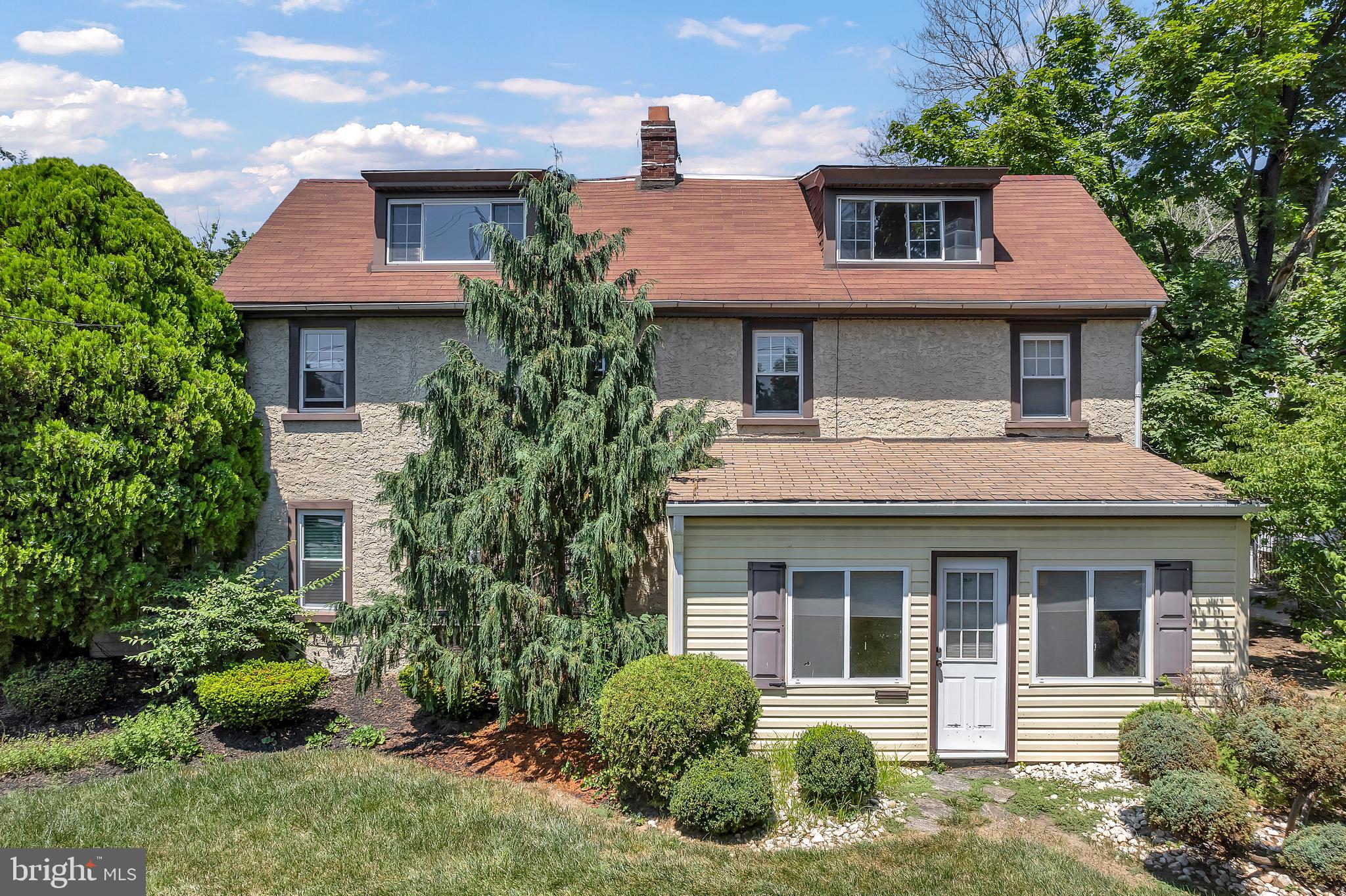 Welcoming back to the market as the Buyer's financing fell through with a NEW PRICE!! 1225 E Washington Lane, A hidden gem nestled on almost half an acre(.45) in the Mt Airy section of the city. This grand home boasts with 3300 square feet, 5 bedrooms, 2.5 baths and an array of original features. The first floor plan offers two bright sun rooms (front and side), a spacious family room, a generous size dining room with original built in cabinets and a huge bay window, large living room with a wood burning fireplace, and an eat in kitchen with stainless steel appliances, granite counters, tons of cabinets, lots of natural sunlight and recessed lighting. Off the kitchen is a pantry area with additional cabinets and a freezer which also gives access to the rear patio. The second floor offers 3 bedrooms ( one is the master), linen closet, hall bath with a jetted shower/tub combo. The master bedroom includes 6 closets (1 cedar), sitting area, a wood burning fireplace and an on suite bathroom with a jetted tub/shower combo. The third floor offers two additional bedrooms. There's a large unfinished basement for storage and includes the washer and dryer, boiler, AC blowers and gas hot water tank. A salt water pool awaits you as a retreat during those hot summer days along with ample patio area for furniture, entertaining etc. The additional yard area in the rear would be the perfect spot for gardening (currently an apple tree and peach tree), or a play area for those with young families. The home concludes with a spacious detached 2 car garage. Other great features include hardwood floors throughout, central air (1st floor only), updated lighting. This bright and sunny home is close to main commuter roads, minutes to the regional rail, public transportation, close to parks, markets, malls and hospitals. The owner has taken care of the home for 51 years, it's now time to pass the baton to the next owner to create new memories and traditions. Schedule your showing today! MOTIVATED SELLER!