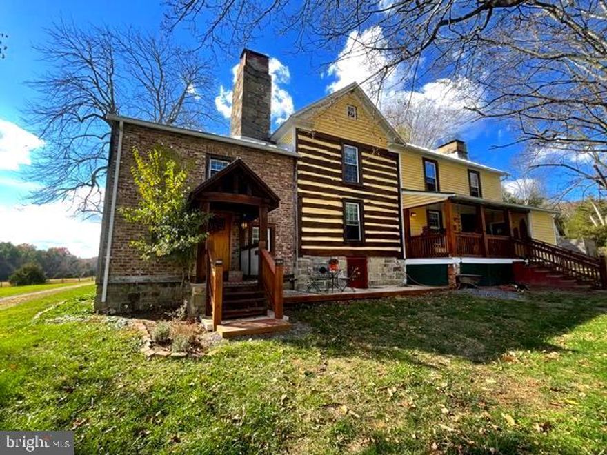 UNRESTRICED  PROPERTY RESTS ON 10.91 USABLE ACRES! NESTLED IN THE SERENE HIDDEN HOLLOWS AREA OF HAMPSHIRE COUNTY IS  THE RARE 1835 LOG-AND-STONE MANOR HOUSE, NOW WITH 2624 SQ, FT.  IN 2017.  THE 2,000 SQ FT  BARNDOMINIUM IS PERFECT FOR STORAGE OR AN OFFICE.  THE 2-LEVEL POST & BEAM BARN HAS  FIBER OPTICS  WHICH IS  GREAT FOR REMOTE WORK.  INSTALLED IS THE NEW ROOF & EXTERIOR STAIN ALONG WITH  INCLUDING A RESTROOM ON THE MAIN LEVEL.  THIS HISTORIC HAMPSHIRE COUNTY GEM HAS ONLY BEEN OFFERED FOR THE THIRD TIME IN 200 YEARS! HISTORIC CHARM MEETS MODERN COMFORT.   THE  MANOR HOUSE BLENDS HISTORY, CRAFTSMANSHIP AND MODERN COMFORT.  AS PART OF THIS RESTORATION, ALL SYSTEMS WERE REPLACED: PLUMBING, ELECTRICAL & HVAC. THE HOME HAS 3 BEDROOMS, 2 FULL BATHS, 5 FIRE PLACES. THIS IS NOT IN A SUBDIVISION.
