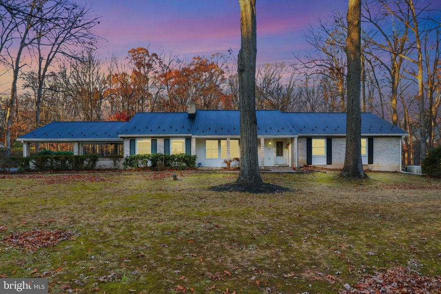 Sprawling Ranch-Style Retreat in rural northern Harford County

Offered for the first time by the original owners, this expansive ranch-style home is a rare find nestled on 3.27 private wooded acres in desirable northern Harford County. This property provides exceptional privacy, bordered in the rear by preserved farmland and facing over 1,500 acres of protected Broad Creek Boy Scout Camp Area of woodland across a quiet country road. There is no HOA or private covenants and restrictions regulating the use of the property.

Enjoy the best of country living with all the modern conveniences: high-speed fiber optic internet keeps streaming, learning, and working from home truly state-of-the-art at this rural address. A stand-alone propane whole-house generator ensures full power year-round—even in the worst weather—providing peace of mind and comfort for your family.

With convenient access to APG, Bel Air, and US Route 1, commuting is easy while you enjoy the serenity of a safe, established area with top-rated public and private schools, and access to County and State managed parks.

The home offers an open floor plan and nearly 4,000 square feet under roof, perfect for both daily living and entertaining. A spacious kitchen with a large breakfast bar flows seamlessly into a welcoming family room with a brick hearth and gas fireplace. The adjacent dining area opens to an enclosed porch, leading out to a deck, pool, and secluded backyard oasis.

Retreat to a large primary suite featuring a walk-in closet and jetted tub, along with generously sized secondary bedrooms. The full walkout lower level, enhanced by daylight windows, offers flexible space for a guest or in-law suite, home office, recreation room, home theater or game simulator.

The pool area awaits your finishing touches and is poised to once again become the centerpiece for gatherings, family fun, and relaxation.

This property is an extraordinary opportunity to own a well-loved home in a peaceful, sought-after location where privacy, nature, and cutting-edge amenities combine for an exceptional country living lifestyle.