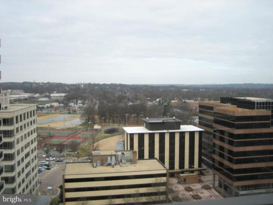 Magnificent view from the 15th floor. 1.5 blocks to metro. Garage Parking for 2 cars. Granite in kit & bath, black/s.s appliances, Jacuzzi tub, loads of closets, in unit washer & dryer, hdwd floors. Wired for DSL and surround sound. 24hr lobby hold packages,mail, admit vitors, answering serv. Pool, exercise rm w/sauna, extra storage. All utilities included, even basic cable!