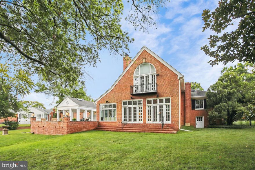 This stunning home, substantially expanded and re-designed by famed Georgetown architect Robert Bell, sits on almost an acre of flat land in a sought after neighborhood in the City of Alexandria. Its classical elegance is apparent immediately upon stepping into the deep front foyer. To the right is the  music room for gathering before making your way to the classic formal dining room with fireplace. Straight ahead from the foyer is the large and beautiful Great Room with built-in bookcases and cabinets, a fireplace, and two sets of French doors, one leading to the sunroom and the other to the expansive backyard. The Great Room, with its warm tones and comfortable furnishings, is a perfect spot to entertain or simply unwind after a long day.

Adjacent to the Great Room is the tranquil sunroom, a haven of serenity that brings the outdoors inside. Natural light pours in through the large windows, illuminating the space and creating an ideal setting for reading, enjoying a cup of tea, or simply basking in the soothing ambience.

The spacious beautiful gourmet kitchen, the central hub of the home, is equipped with two prep sink areas, modern high end appliances, cabinetry, and countertops, and a walk-in Butler’s pantry with wine refrigerator, making the kitchen a delight for culinary enthusiasts. French doors in the kitchen lead out to a large bluestone slate patio with a Grecian style outdoor open air dining room with a large barbecue cooking center, cabinets, skylights, and overhead ceiling fans.

Upstairs, you’ll discover an expansive well appointed primary bedroom that provides a serene retreat at the end of the day. The suite has soaring ceilings and arched windows, a fireplace, ensuite bathroom, and three separate closets. All of this provides a perfect blend of relaxation and convenience. There are two other large bedrooms and bath in the mid level wing of the house.

There is storage galore with a walk-in Butler’s pantry, 10 closets, basement and attic.

There is a full size two car garage with loads of off street parking, ready to welcome your guests. Top it all off with the great private and level backyard, convenient walking or short biking to both public and private schools, and a bus to metro stop across the street.

This wonderful home simply has it all. Welcome and enjoy.