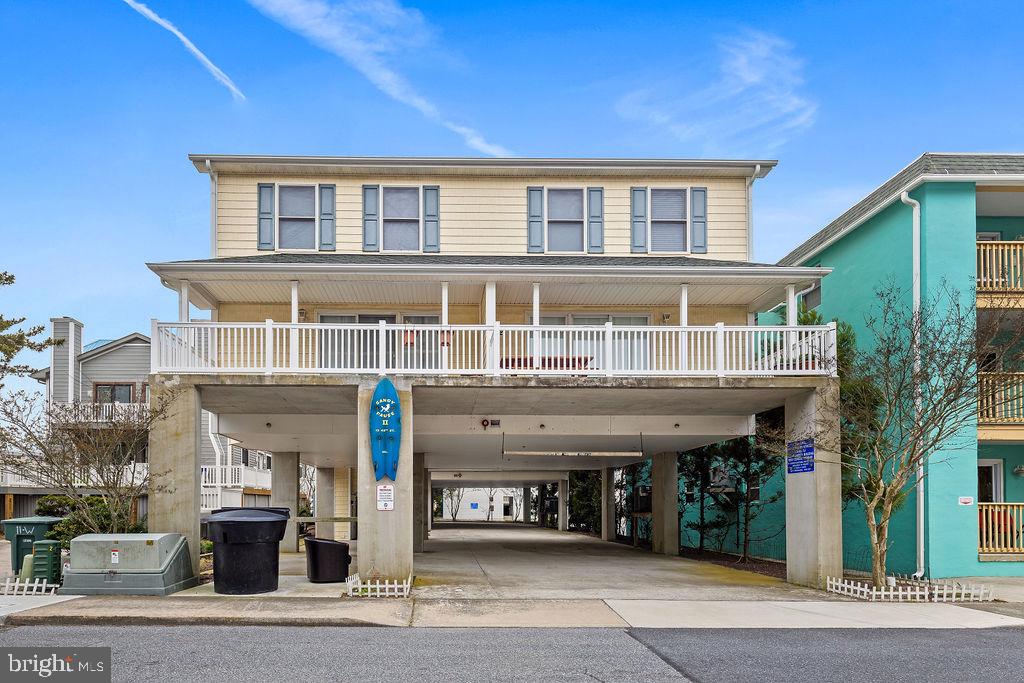 Spectacular Ocean block 2 level end unit condo is just a short walk to the beach! Wonderful open entertaining floor plan on the main level leading to a spacious partially covered concrete deck! This end unit features numerous windows which affords you many sun filled beach days. The large sliding glass doors leads you to a mostly covered 19-8 concrete deck perfect for those late day crab feasts. The main level features the ultimate entertaining floor plan with a fireplace! The large kitchen overlooking the family room is loaded with cabinetry and boasts a huge breakfast bar. The primary bedroom features a large walk-in closet, crown molding, ceiling fan, large window and a full bath. The 2nd bedroom also features a walk-in closet and crown molding. The 3rd bedroom features a bunk bed and crown molding. The laundry is conveniently located upstairs and features a full size washer and dryer. The unit comes fully furnished minus several staging props provided by the stager. The exterior was just professionally power washed. ALL CURRENT 2022 RENTALS MUST BE HONORED.
