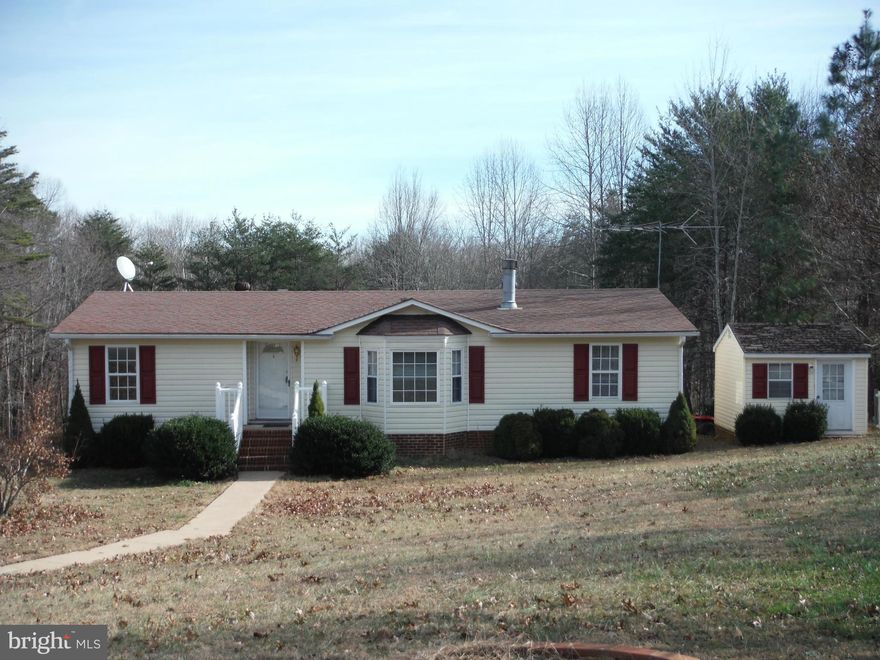 Short Sale. Only 1 bank! Louisa county double wide home on a permanent foundation on 3 acres of land. Granite counter tops, large master bath, newer windows, interior and exterior doors, and a lovely bay window create a place to call home near Lake Anna. Air conditioned and carpeted shed next to the home! Don't miss this very affordable opportunity!