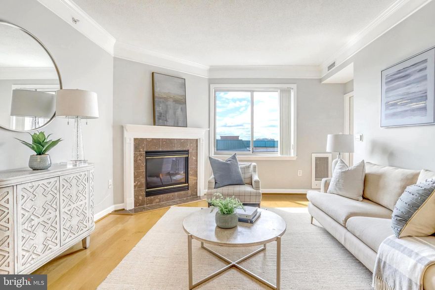 Seller requests offers by 5pm on Monday 5/8 .** An incredible opportunity to own in one of N. Arlington’s most sought-after buildings! Rarely available 1 bedroom (plus large den), 1 bathroom, 857 sq ft unit has an open concept floorplan.  Step into the unit and be greeted with hardwood floors throughout, and large windows allowing an abundance of natural light. The kitchen has ample cabinetry for storage and has everything you need to prepare your favorite meals. Cozy up to the gas fireplace during winter months or enjoy warmer weather on your private balcony with views of the tranquil courtyard and pool from the 11th floor. A large bedroom provides the perfect retreat after a long day. The walkthrough closet connects to a generously sized bathroom with shower tub. The oversized den provides multiple options – big enough to fit a queen-size bed or used as a large office. 

Situated between Ballston and Clarendon, this building is steps away from restaurants, bars, shops, and nightlife. Transportation couldn’t be easier with the Virginia Square Metro Station directly across the street and 1 parking space that conveys (ask about options for additional parking)! Additional storage unit conveys. Amenities include a gym, pool, community room, and the convenience of on-site management. Come see for yourself! Seller reserves right to accept an offer before the deadline.