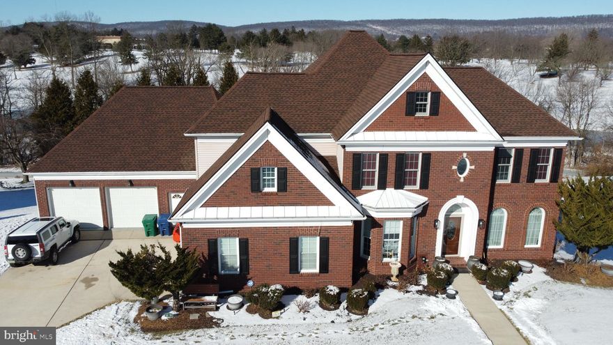 Experience unparalleled elegance at 4972 Farmington Road, a masterfully renovated residence situated in the highly coveted Winchester Park community. This distinguished 5-bedroom, 4.5-bathroom estate represents the pinnacle of thoughtful design, boasting over 6,300 square feet of finished living space, major renovations throughout and a 4-car garage. The sprawling floor plan is anchored by a magnificent primary suite, featuring a private sitting room and a massive walk-in closet, while three additional spacious bedrooms also offer generous walk-in storage. For those seeking multi-generational living or guest privacy, the fifth bedroom serves as a dedicated in-law suite complete with its own separate entrance.

The interior is a sanctuary for hobbies and wellness alike, offering a dedicated exercise room, game room, and craft room. For the hobbyist or collector, the lower level features a massive heated workman and storage garage, providing a climate-controlled environment for any project. Peace of mind comes standard with a new roof, furnace, and water heater all replaced within the last three years.

Outdoors, the property transforms into an entertainer’s dream with professional landscaping and breathtaking views of the Colonial Club golf course. Both the upper and lower patios are equipped with dedicated gas lines, ready for your patio heaters or fire tables to create a year-round outdoor oasis. This is a rare opportunity to own a meticulously maintained, one-of-a-kind home in one of the area’s most desirable locations.